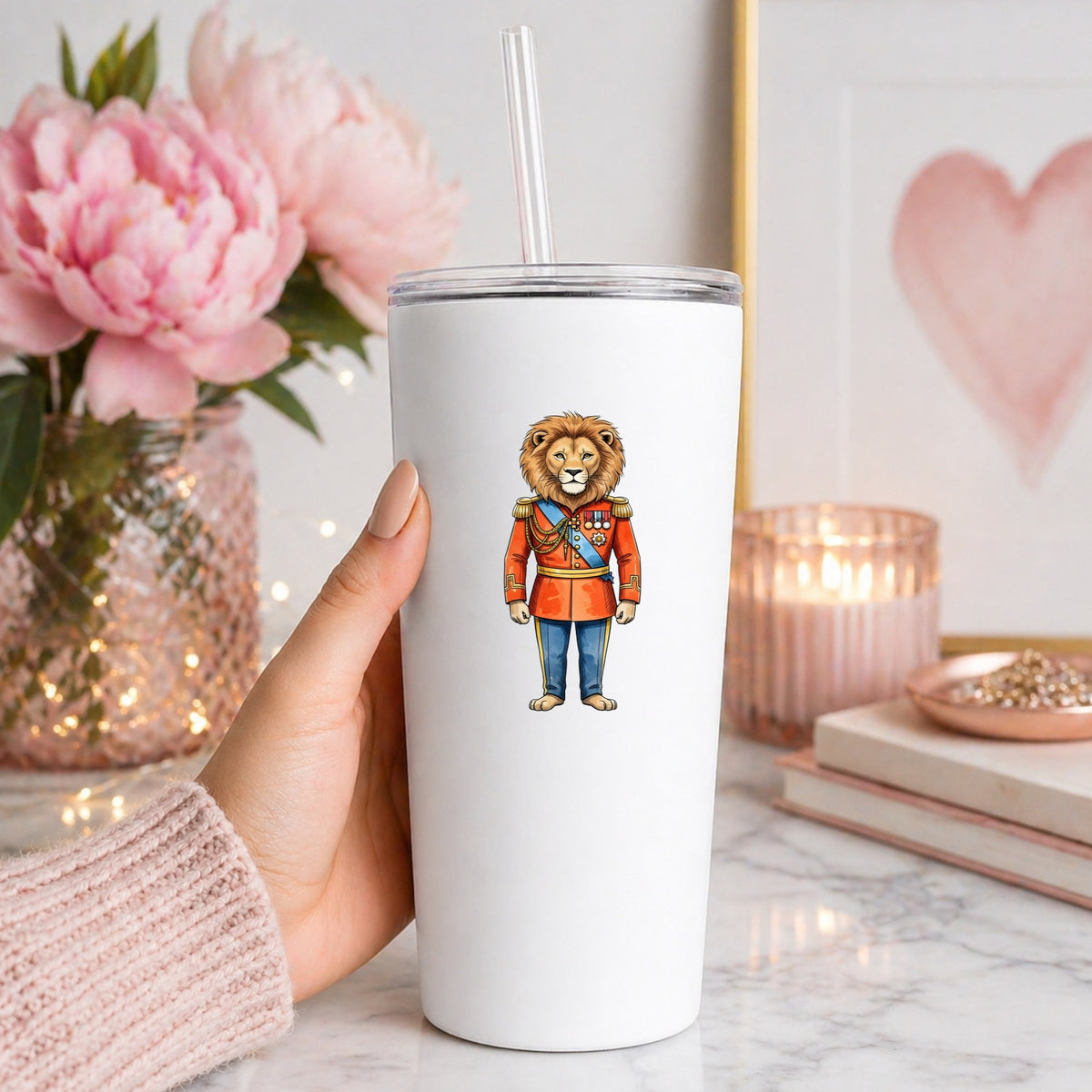 Lion Red Military Uniform UV DTF sticker applied to a white straw tumbler beside pink peonies