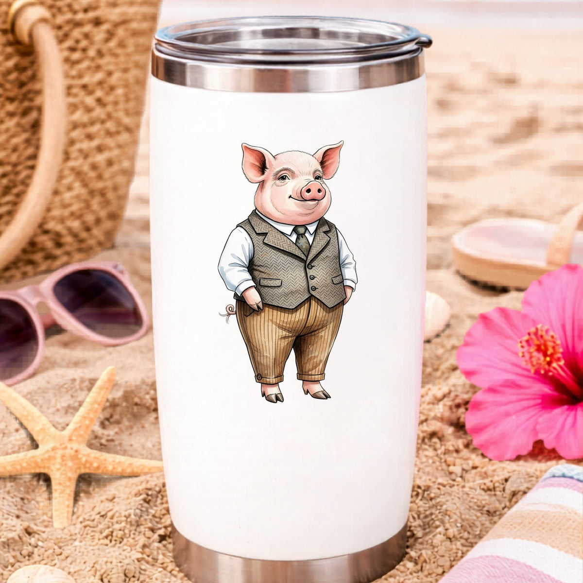 Pig In Tweed Vest UV DTF sticker applied to a white travel tumbler on beach sand