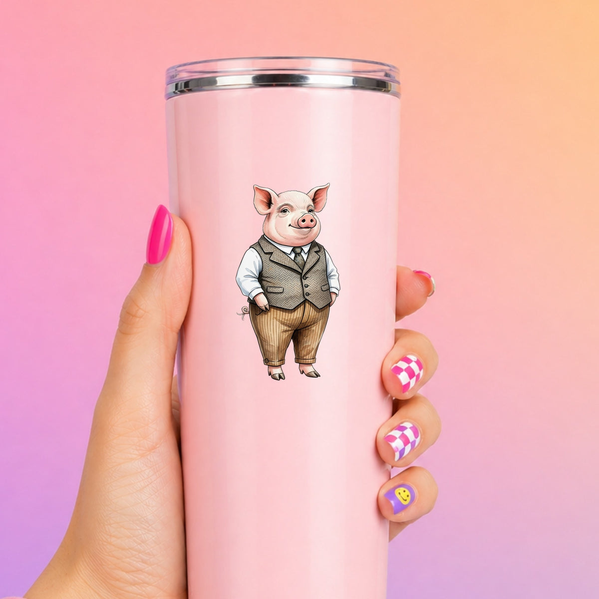 Pig In Tweed Vest UV DTF sticker applied to a tall pink tumbler on a pink and orange background
