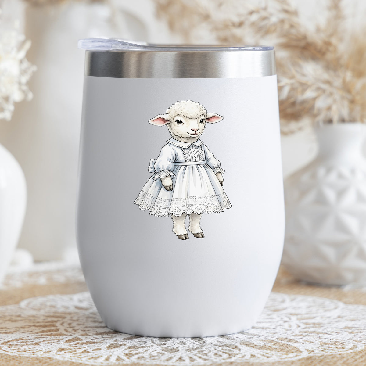 Lamb In White Lace Dress UV DTF sticker applied to a white stemless tumbler with a lid