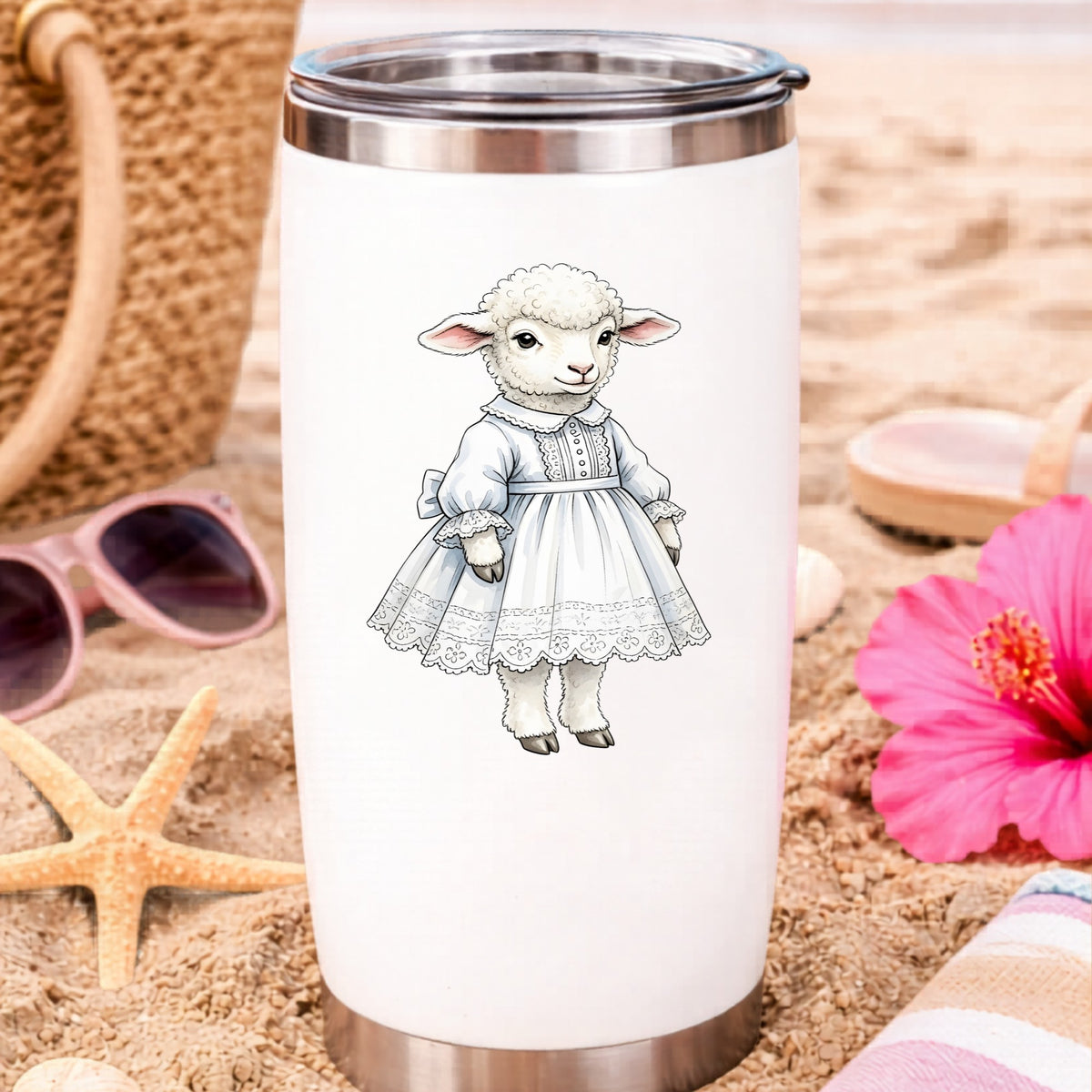 Lamb In White Lace Dress UV DTF sticker applied to a white travel tumbler on beach sand