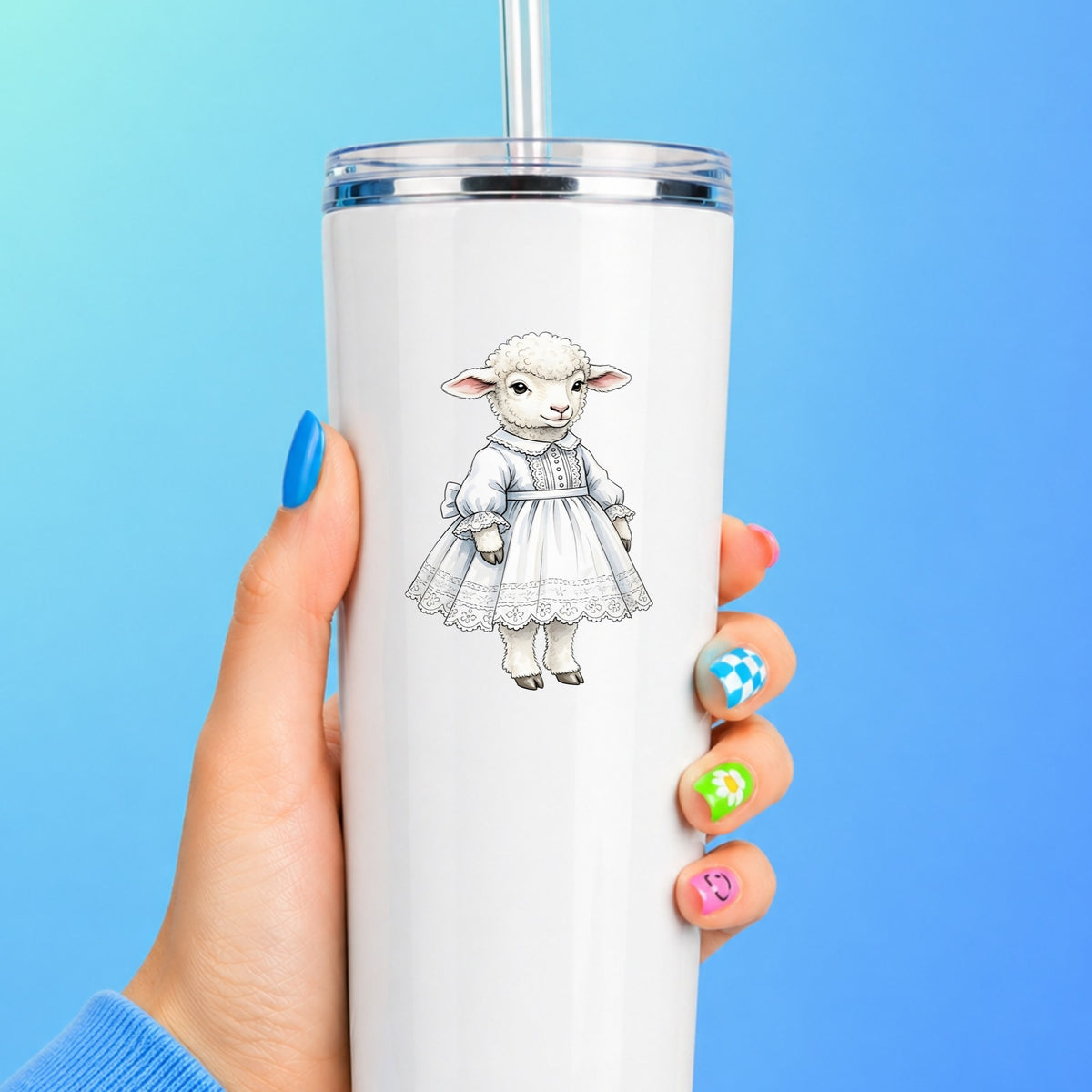 Lamb In White Lace Dress UV DTF sticker applied to a white straw tumbler on a blue background
