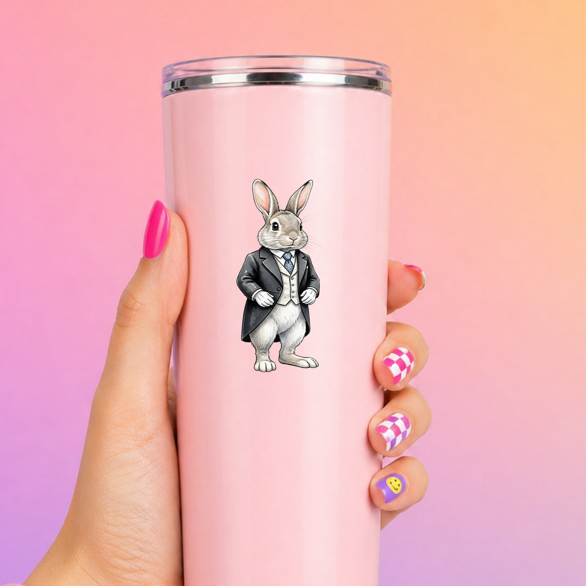 Rabbit Black Tailcoat Blue Tie UV DTF sticker applied to a tall pink tumbler on a pink and orange background
