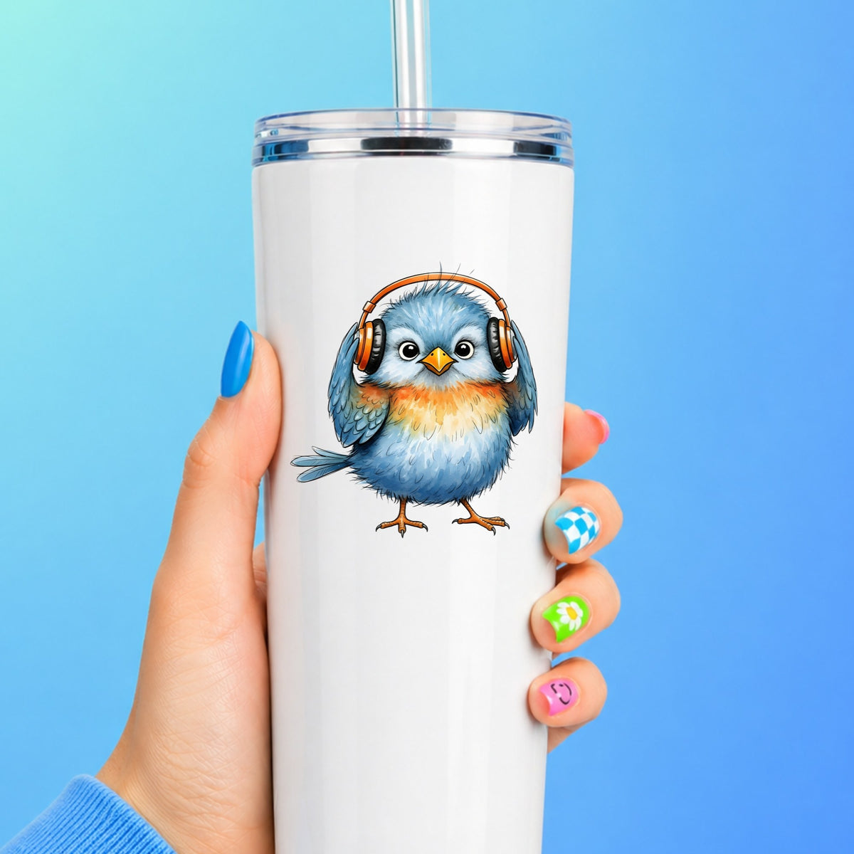 Blue Bird With Headphones UV DTF sticker applied to a white straw tumbler on a blue background