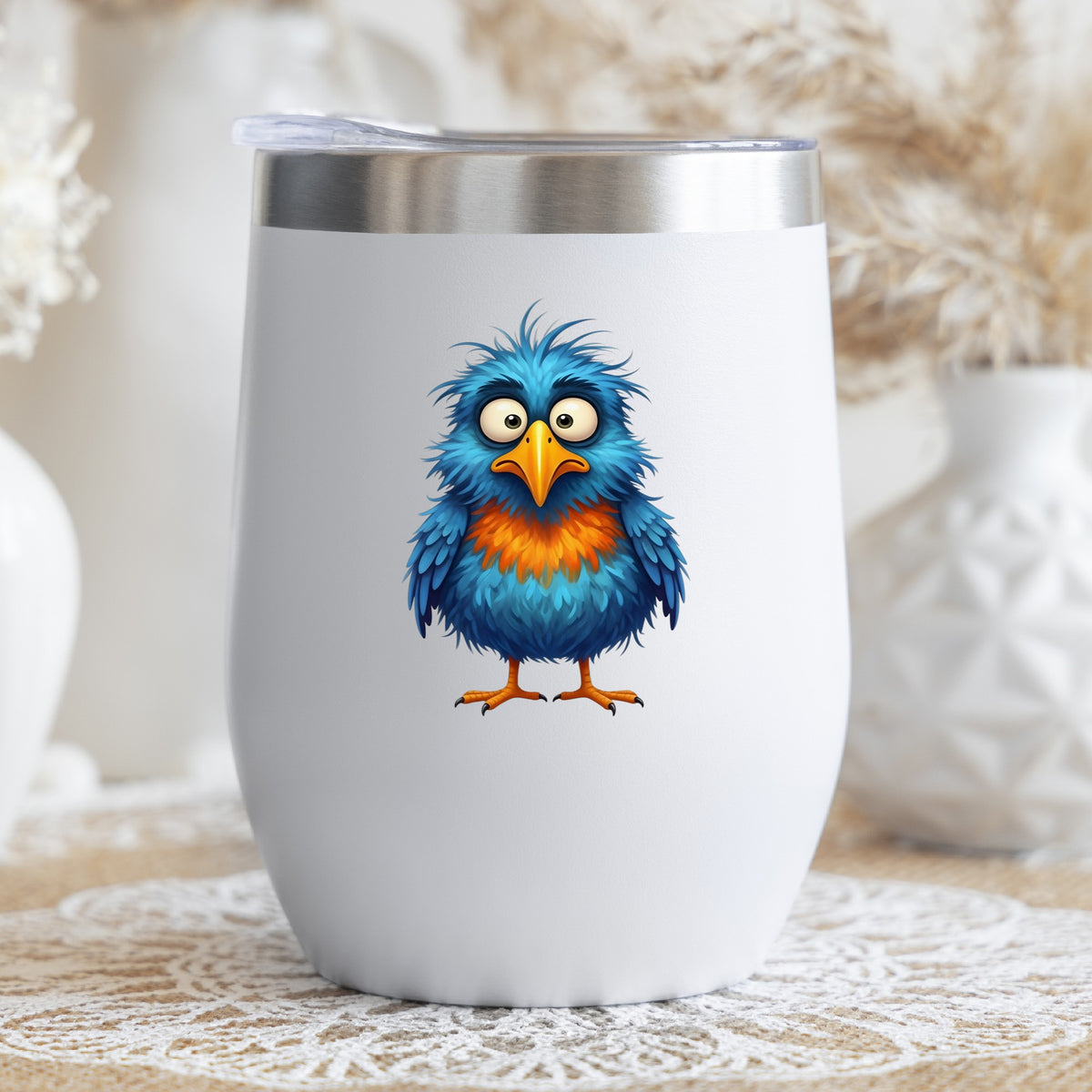 Wide Eyed Shaggy Blue Bird UV DTF sticker applied to a white stemless tumbler with a lid