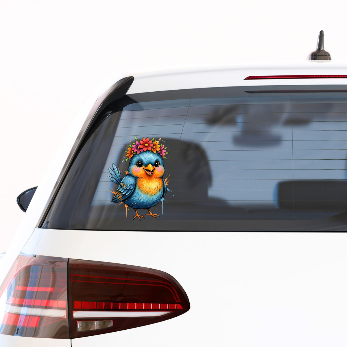 Flower Crown Blue Bird UV DTF sticker applied to the rear window of a white car