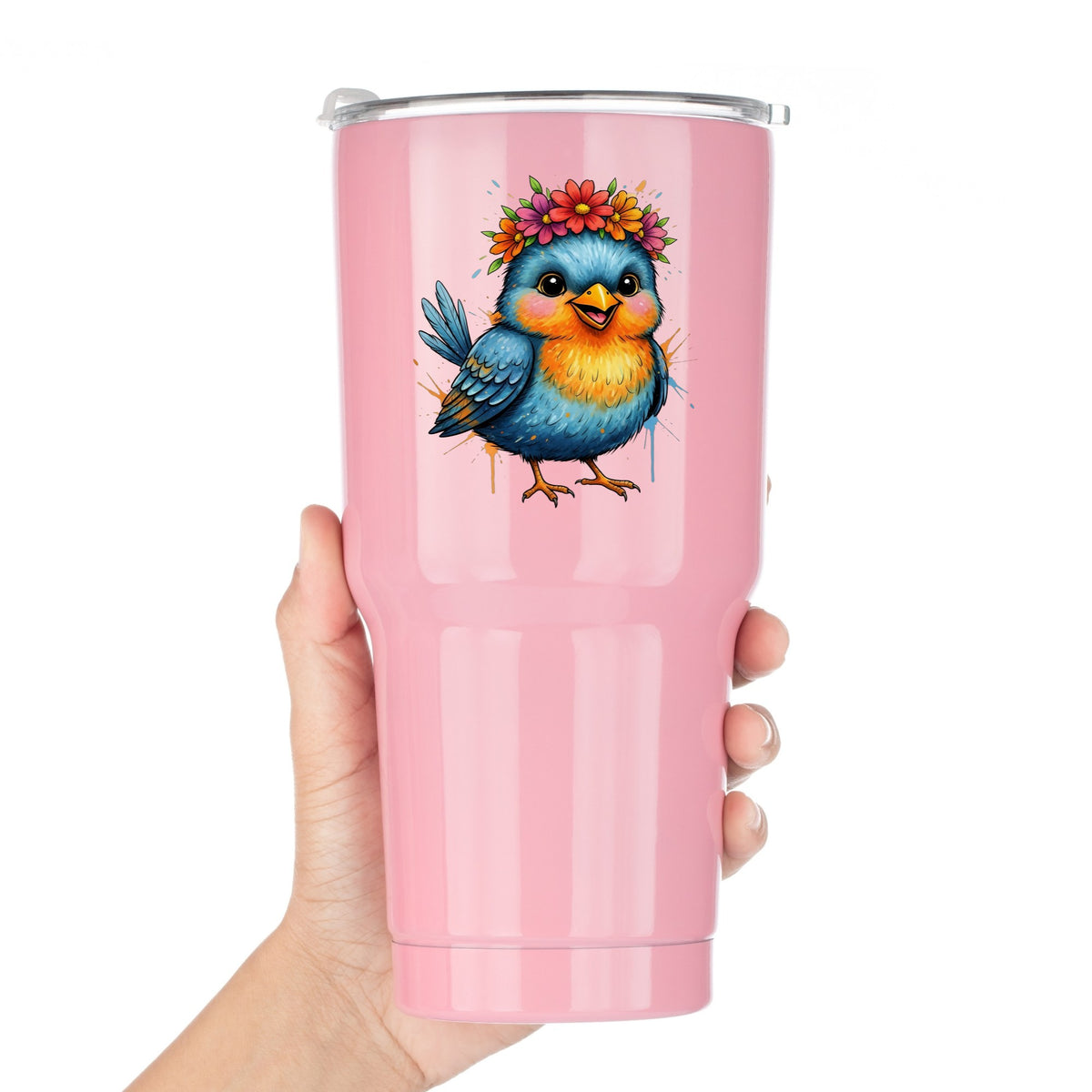 Flower Crown Blue Bird UV DTF sticker applied to a pink tumbler held against a white background