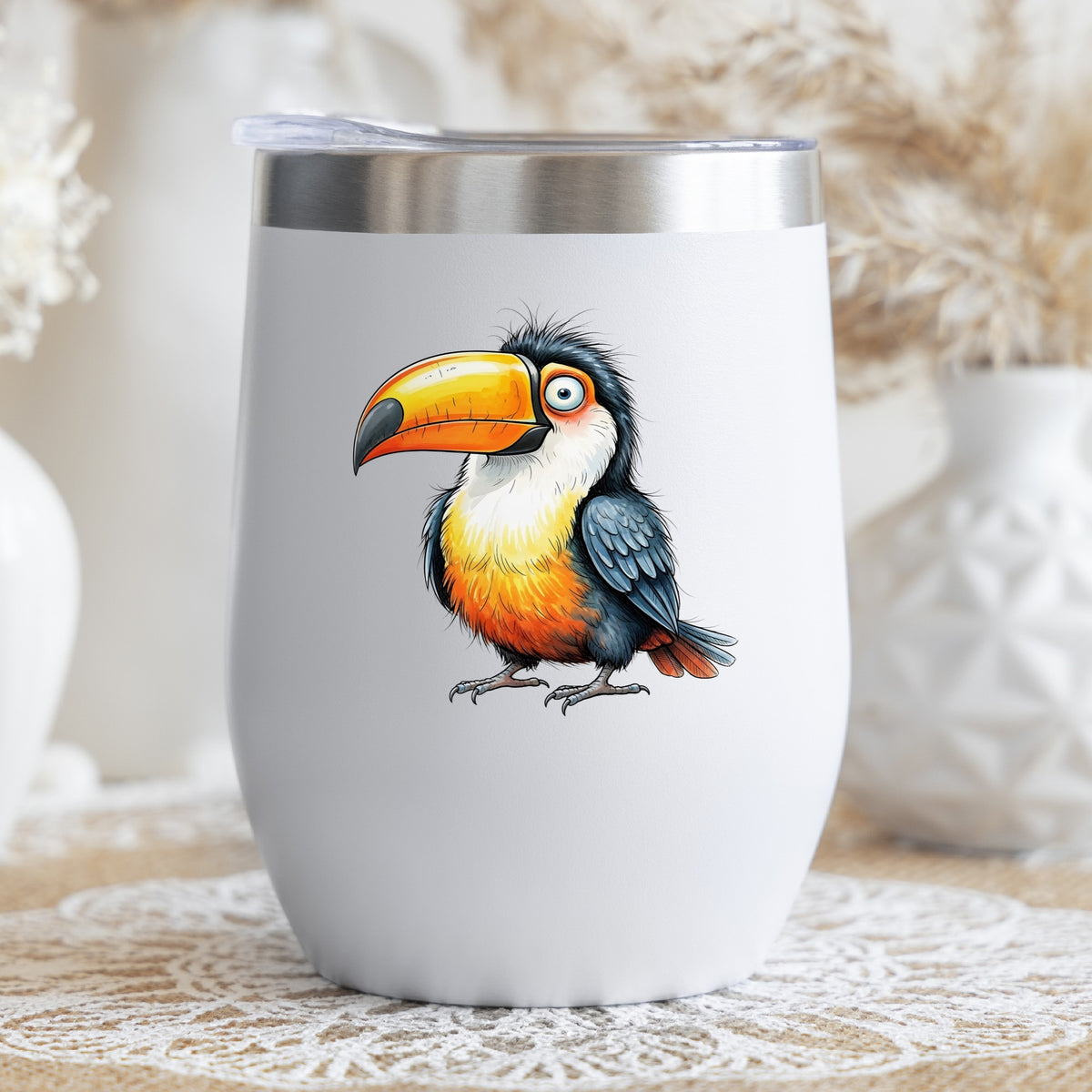 Toucan Big Orange Beak UV DTF sticker applied to a white stemless tumbler with a lid