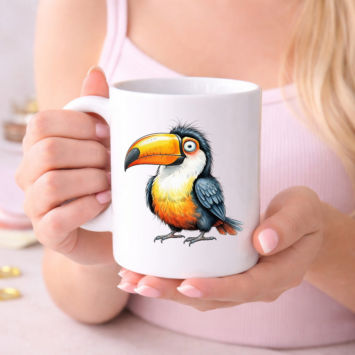 Toucan Big Orange Beak UV DTF sticker applied to a white coffee mug held in both hands