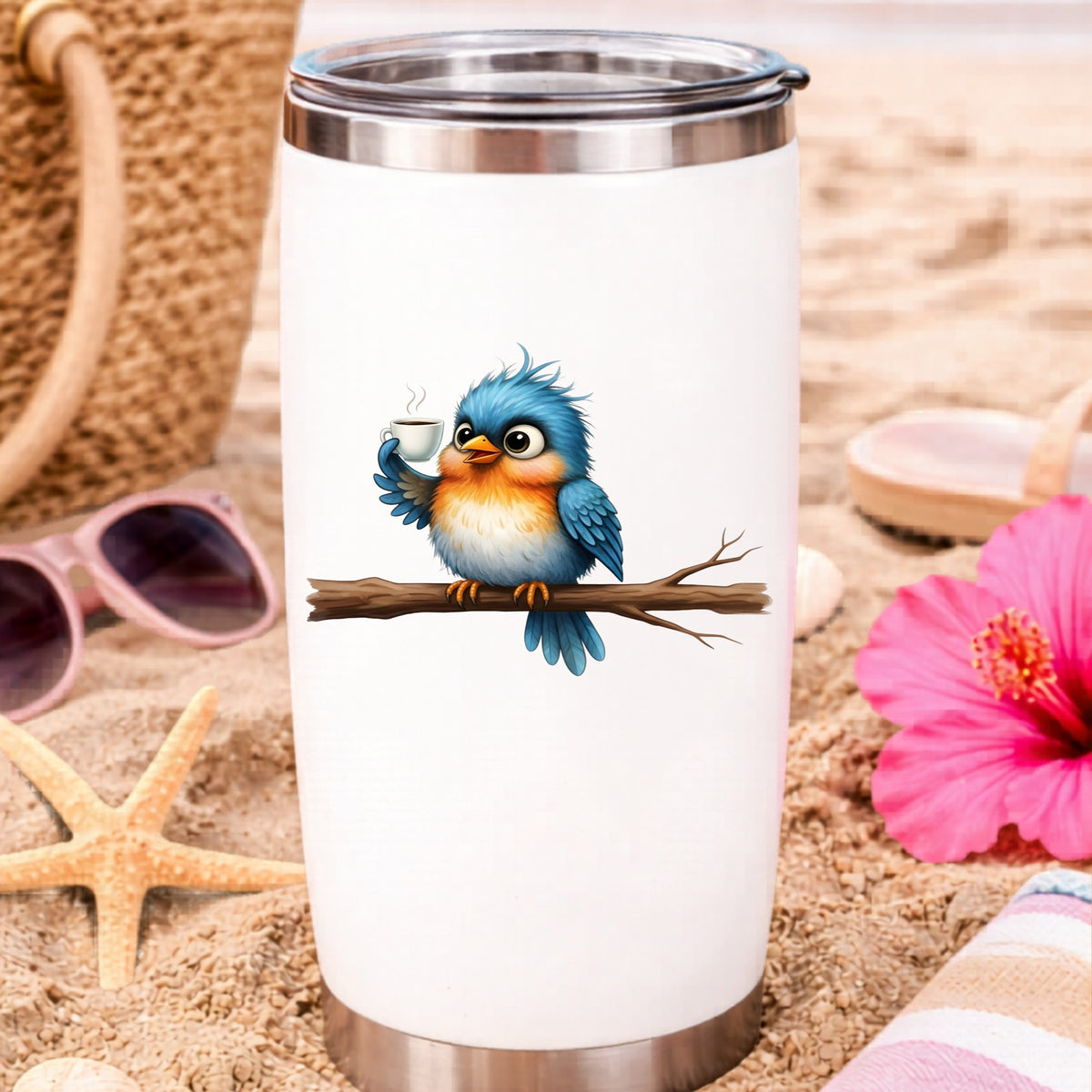Bird Drinking Coffee On Branch UV DTF sticker applied to a white travel tumbler on beach sand