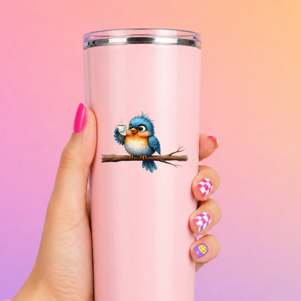 Bird Drinking Coffee On Branch UV DTF sticker applied to a tall pink tumbler on a pink and orange background