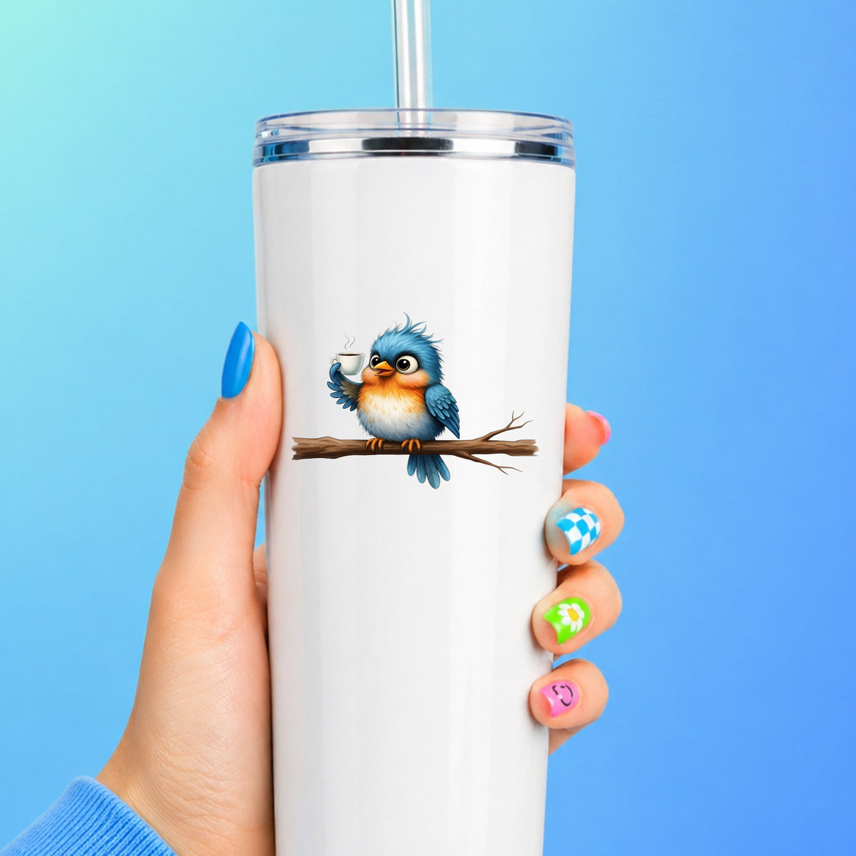 Bird Drinking Coffee On Branch UV DTF sticker applied to a white straw tumbler on a blue background