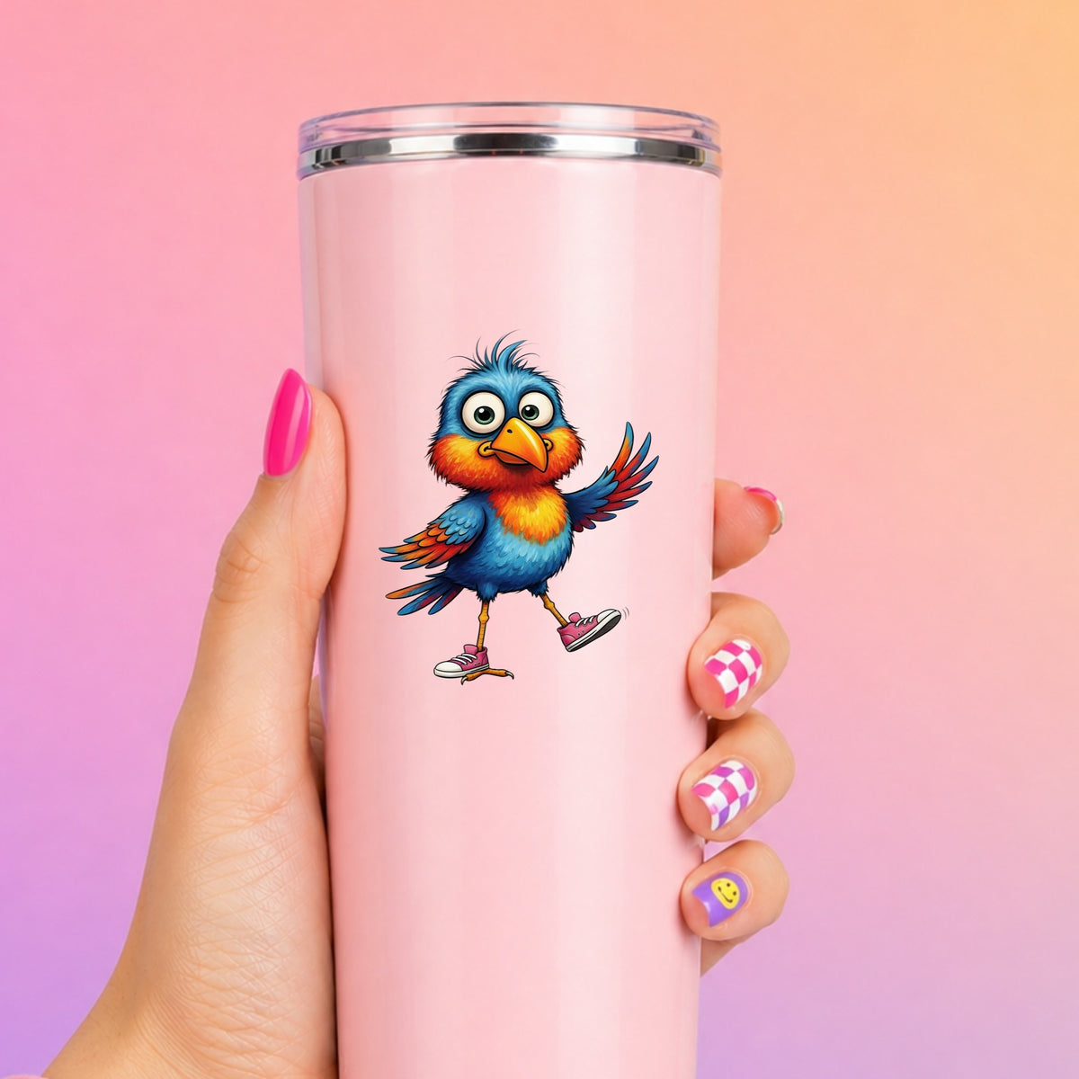 Bird In Pink Sneakers UV DTF sticker applied to a tall pink tumbler on a pink and orange background