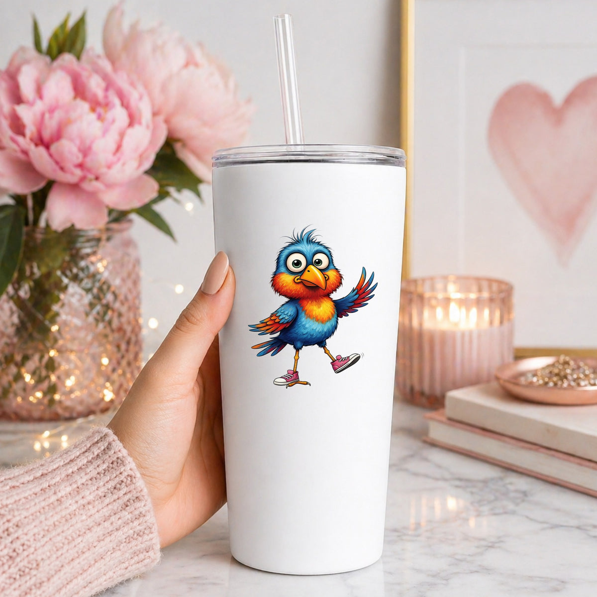 Bird In Pink Sneakers UV DTF sticker applied to a white straw tumbler beside pink peonies