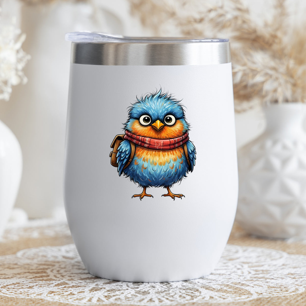 Bird With Red Scarf And Backpack UV DTF sticker applied to a white stemless tumbler with a lid