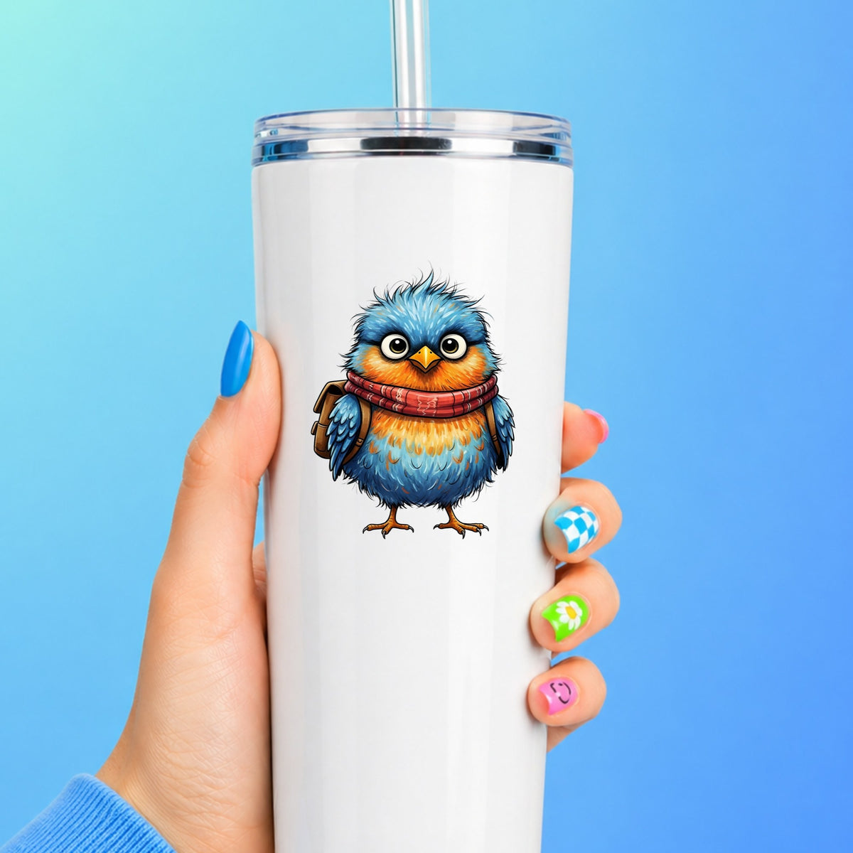 Bird With Red Scarf And Backpack UV DTF sticker applied to a white straw tumbler on a blue background
