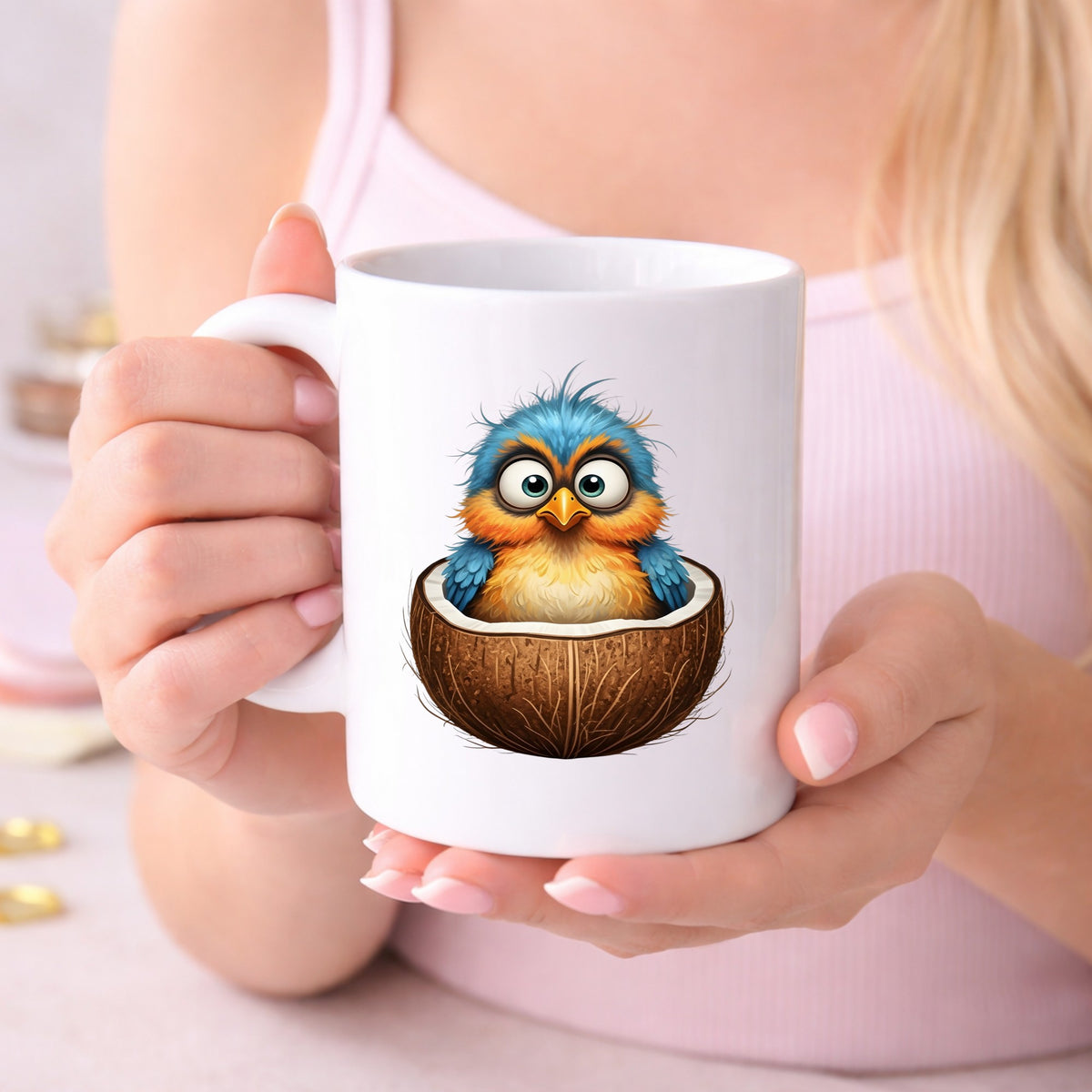 Baby Bird In Coconut Shell UV DTF sticker applied to a white coffee mug held in both hands