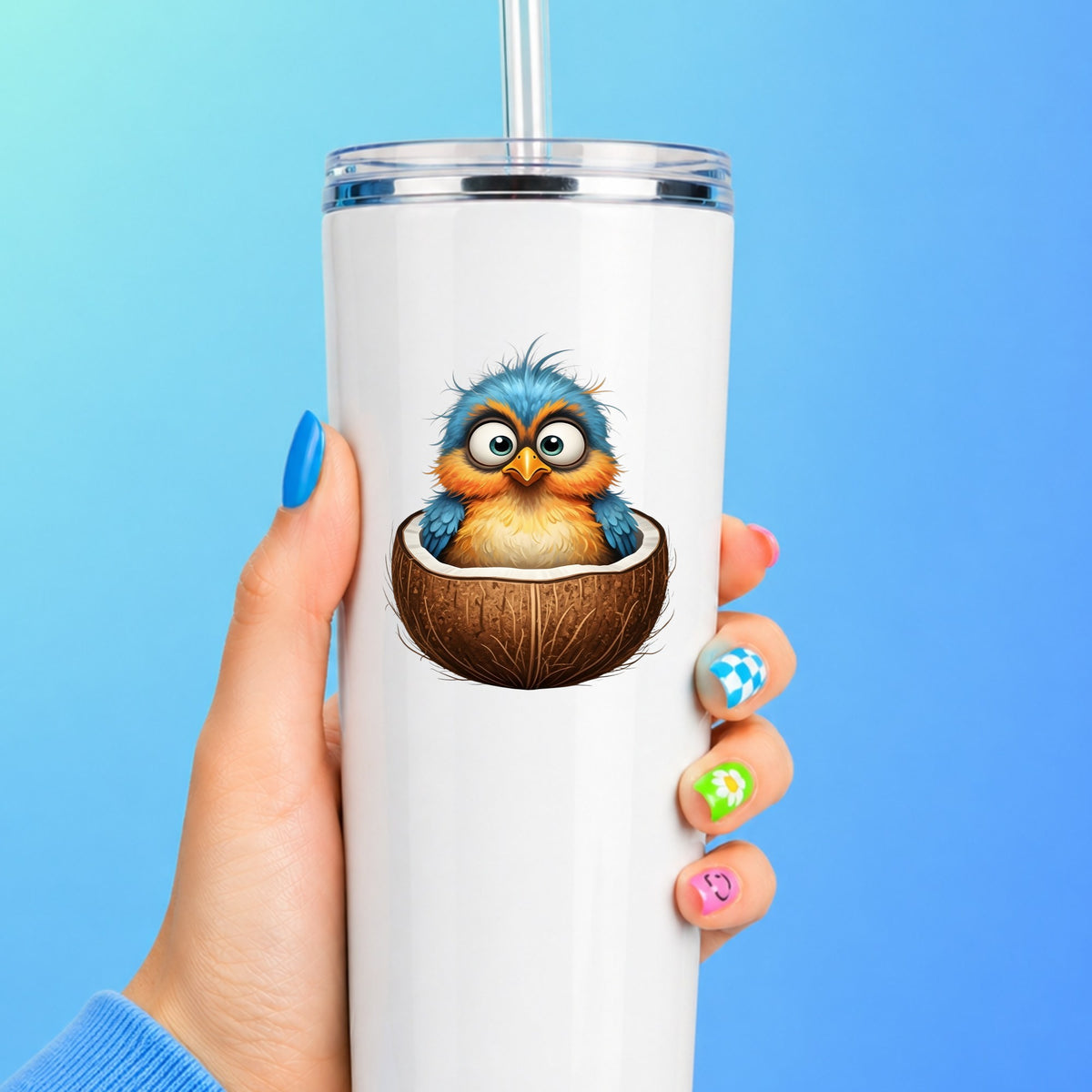 Baby Bird In Coconut Shell UV DTF sticker applied to a white straw tumbler on a blue background