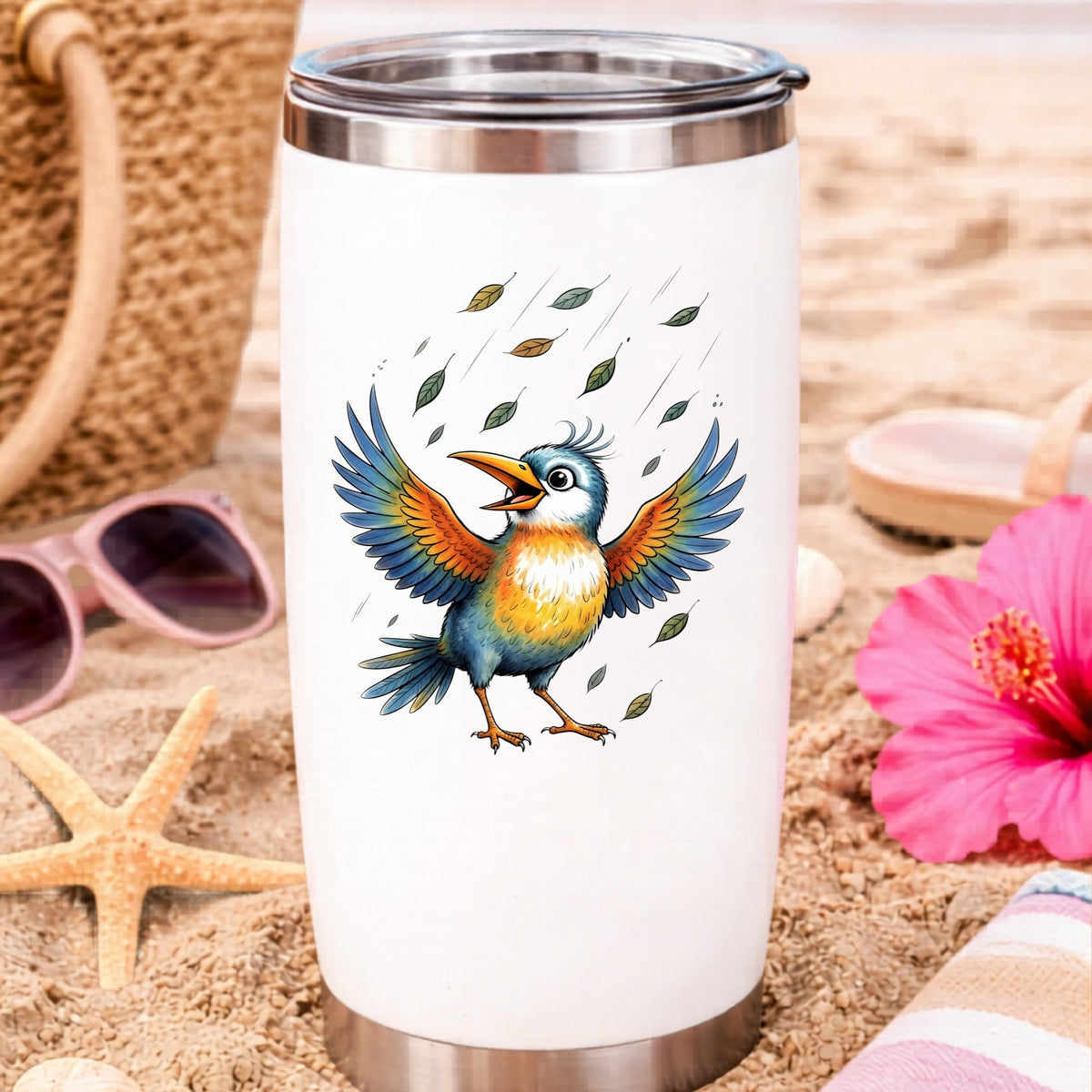 Happy Bird Wings Spread Falling Leaves UV DTF sticker applied to a white travel tumbler on beach sand
