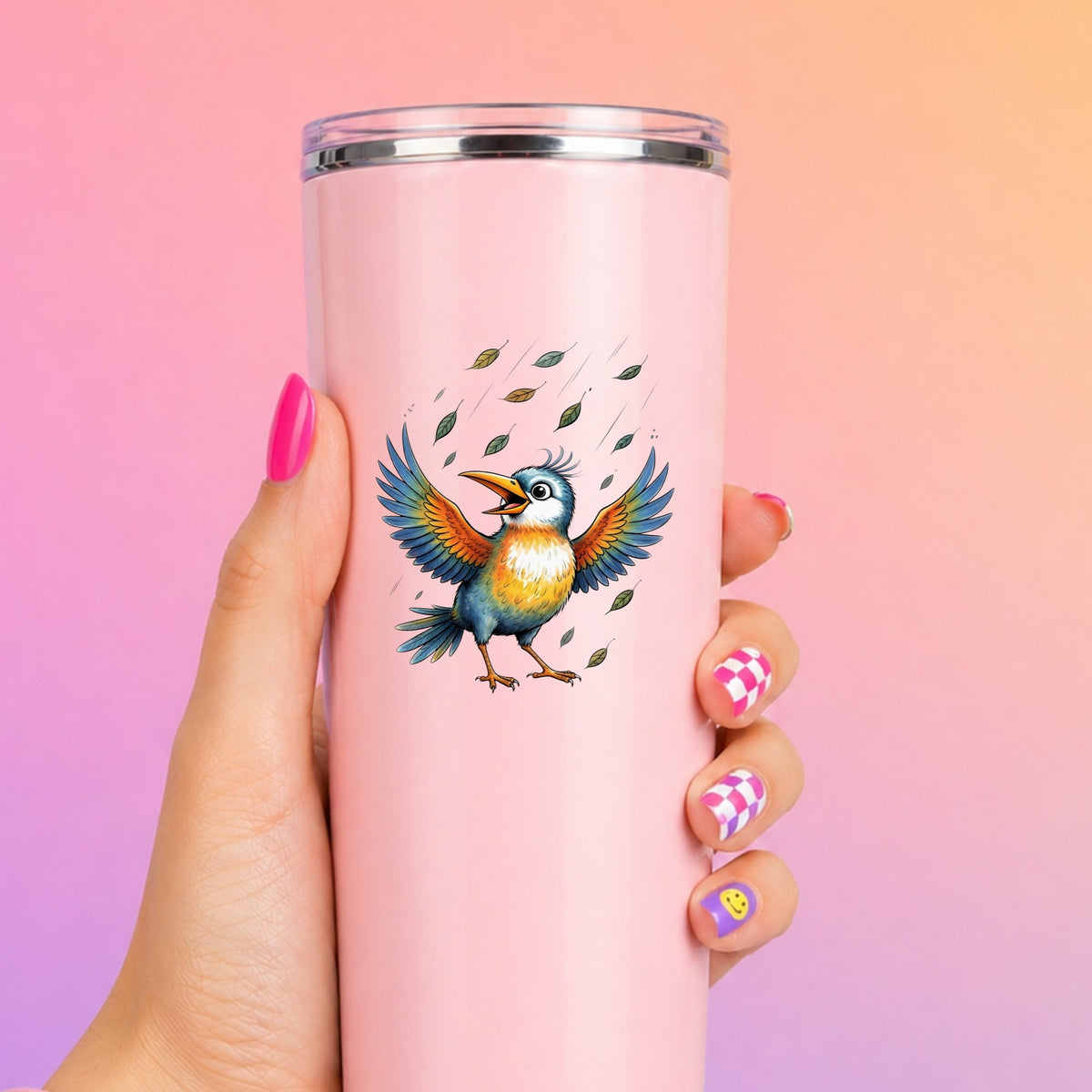 Happy Bird Wings Spread Falling Leaves UV DTF sticker applied to a tall pink tumbler on a pink and orange background