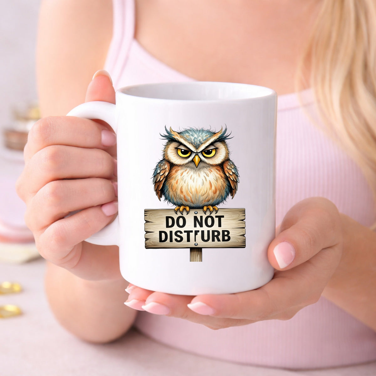 Grumpy Owl Do Not Disturb Sign UV DTF sticker applied to a white coffee mug held in both hands
