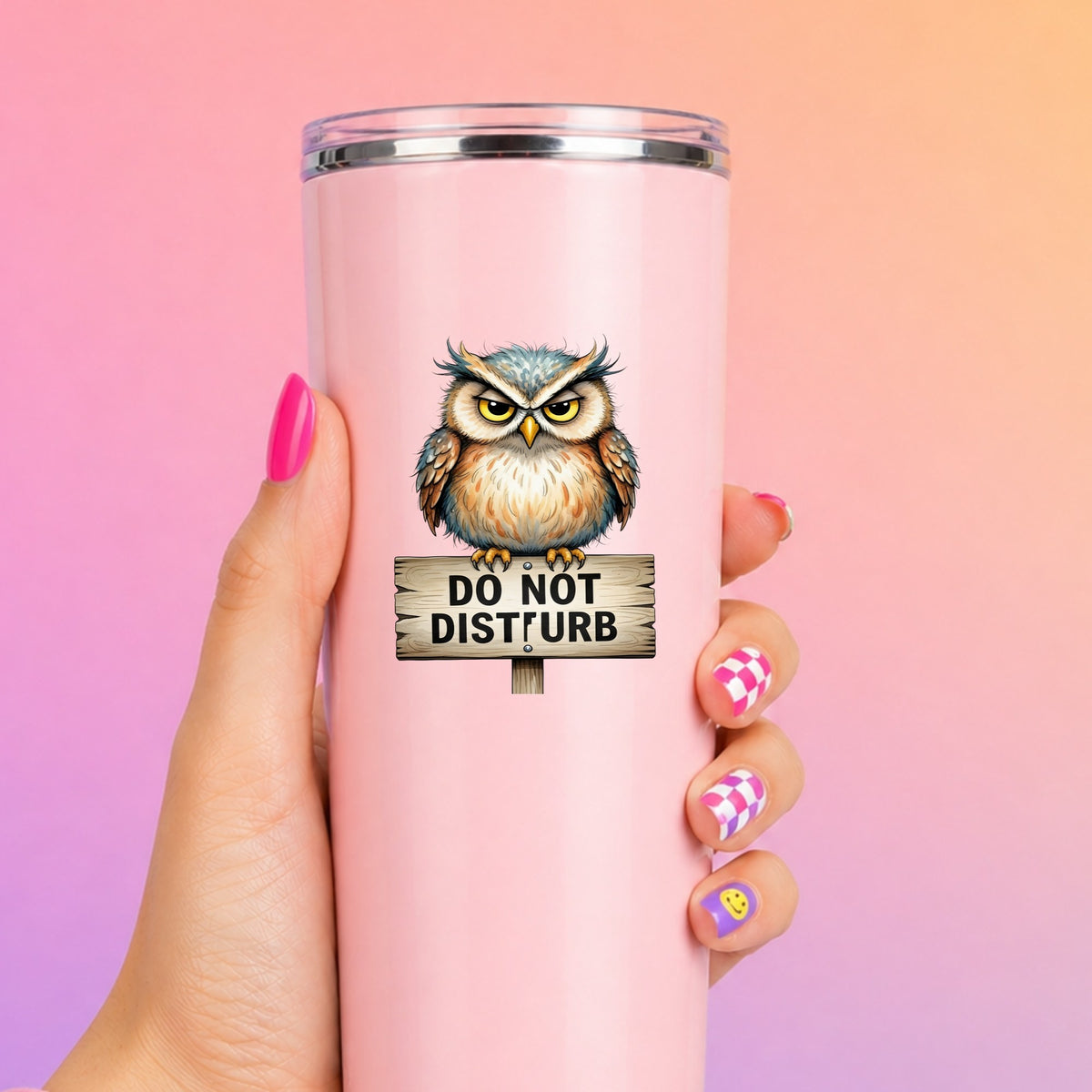 Grumpy Owl Do Not Disturb Sign UV DTF sticker applied to a tall pink tumbler on a pink and orange background