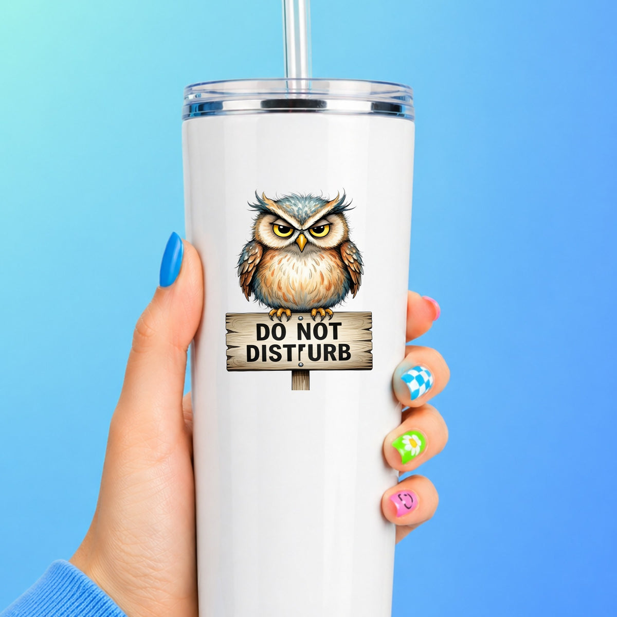 Grumpy Owl Do Not Disturb Sign UV DTF sticker applied to a white straw tumbler on a blue background