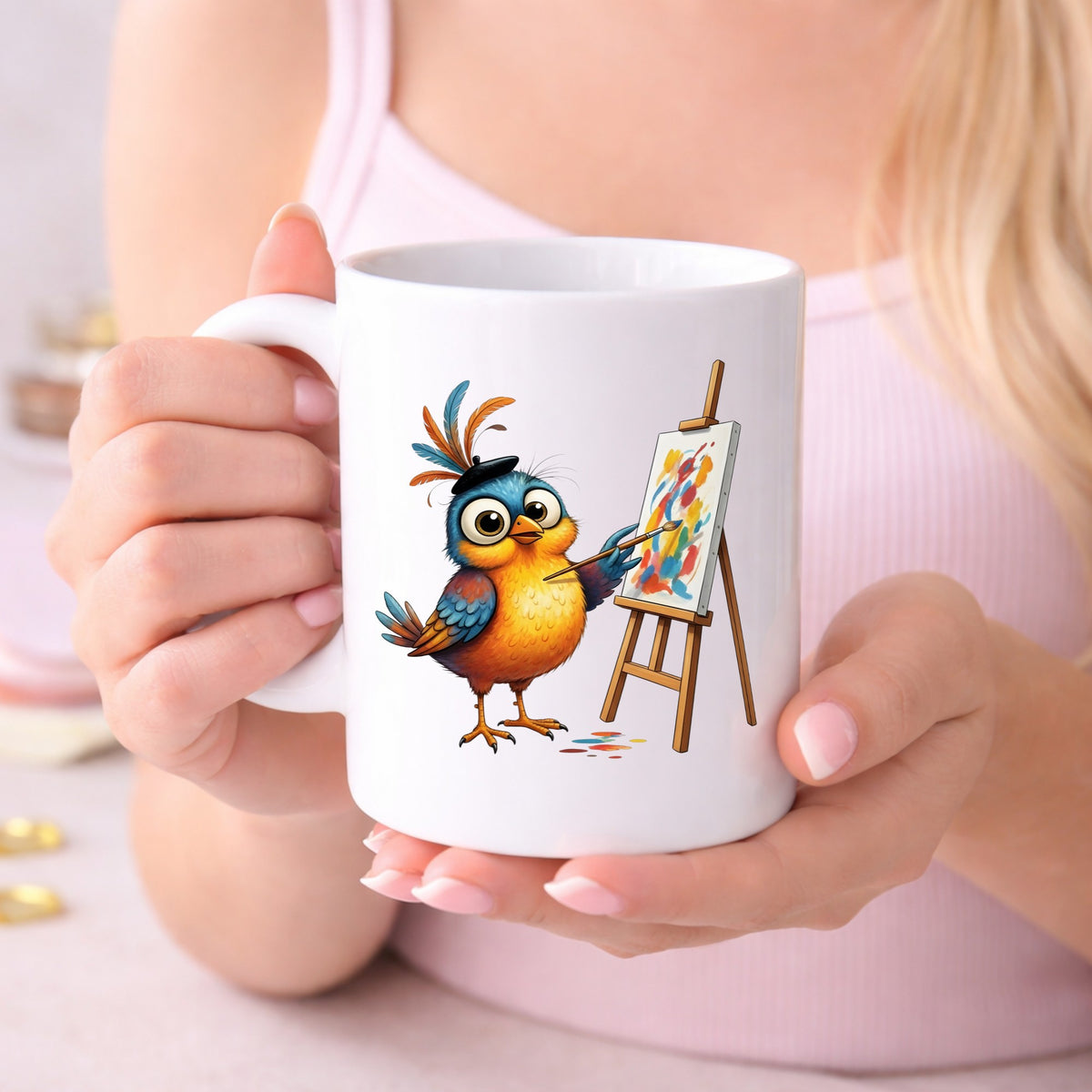 Artist Bird Painting Easel Beret UV DTF sticker applied to a white coffee mug held in both hands