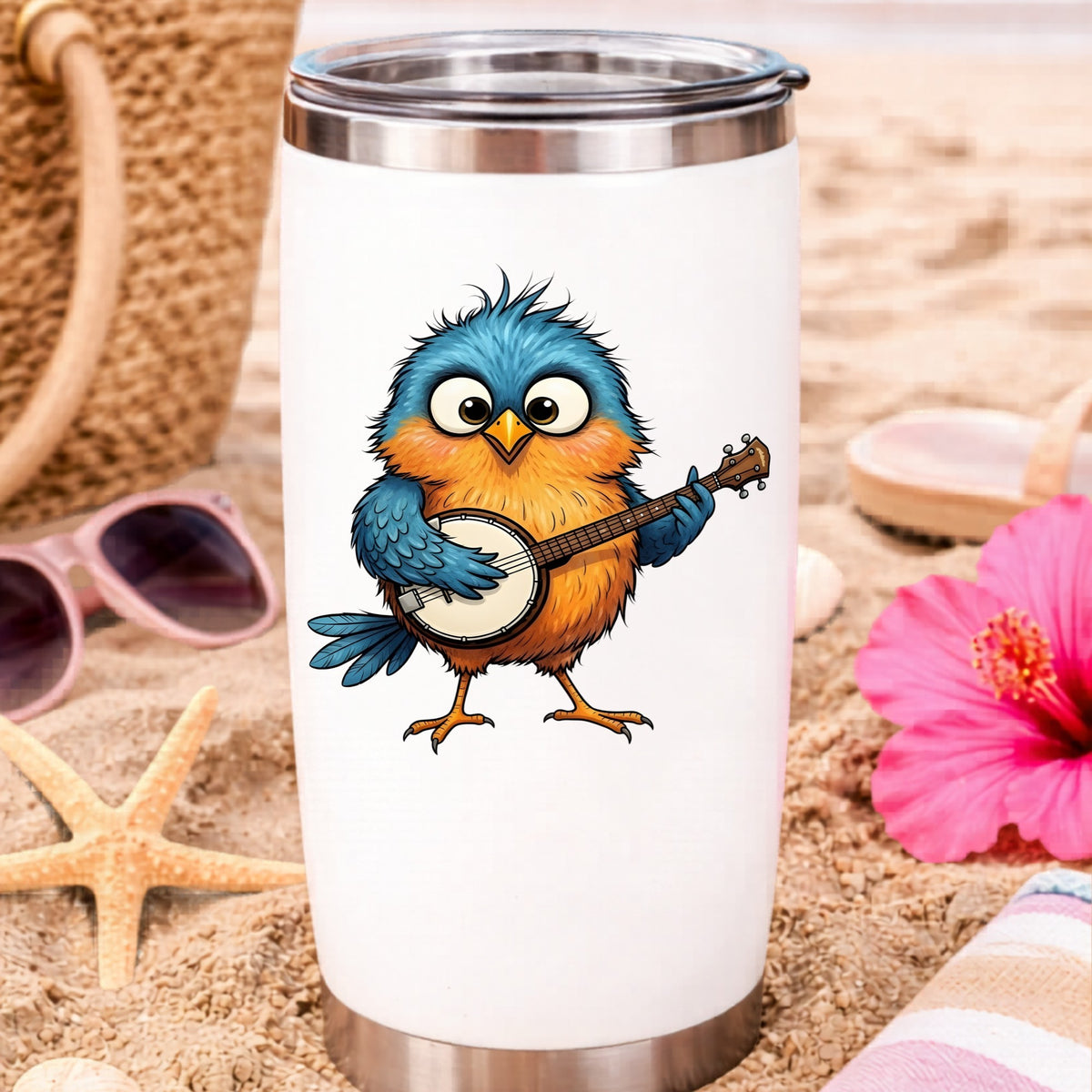 Bird Playing Banjo UV DTF sticker applied to a white travel tumbler on beach sand