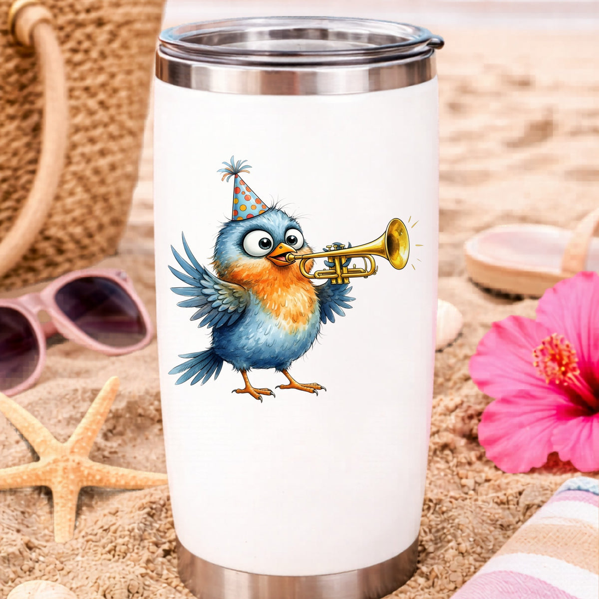 Party Hat Bird Trumpet UV DTF sticker applied to a white travel tumbler on beach sand