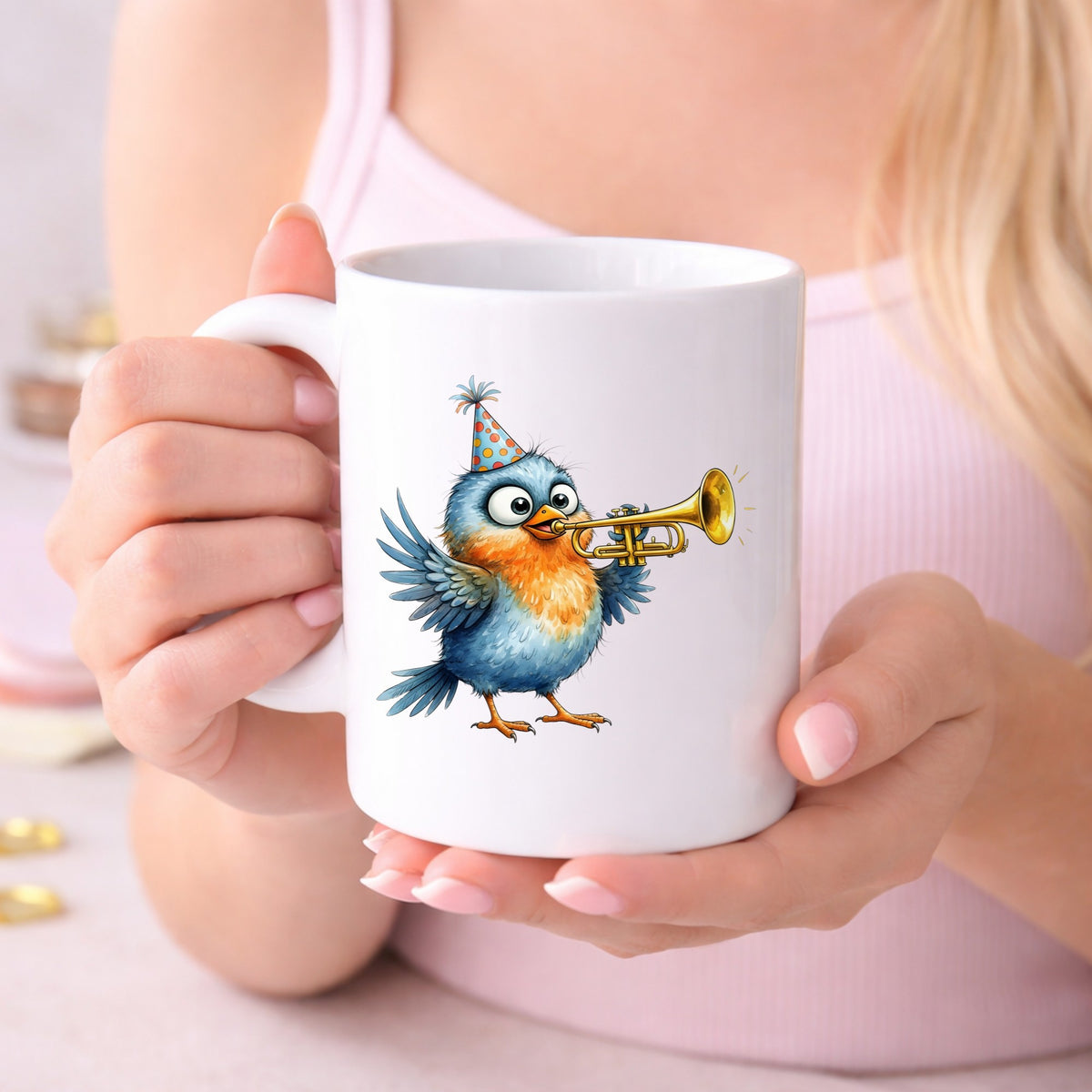 Party Hat Bird Trumpet UV DTF sticker applied to a white coffee mug held in both hands