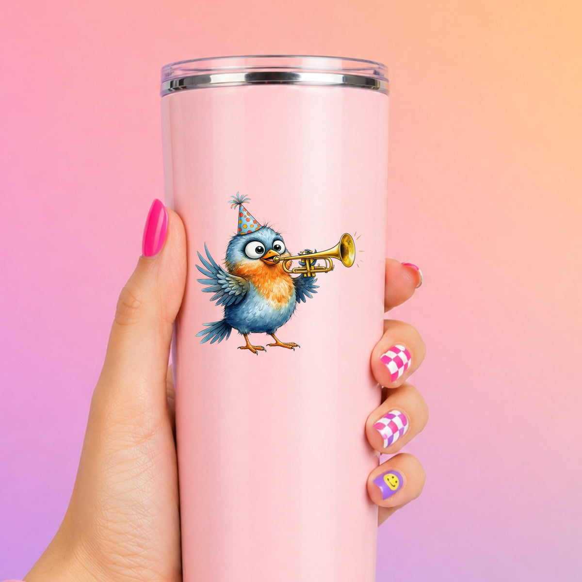 Party Hat Bird Trumpet UV DTF sticker applied to a tall pink tumbler on a pink and orange background