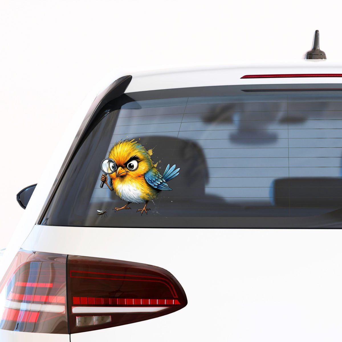 Yellow Bird Magnifying Glass Bug UV DTF sticker applied to the rear window of a white car