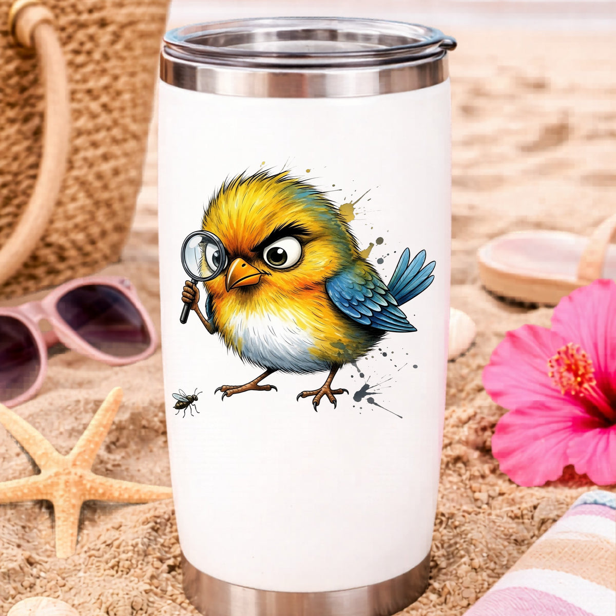 Yellow Bird Magnifying Glass Bug UV DTF sticker applied to a white travel tumbler on beach sand
