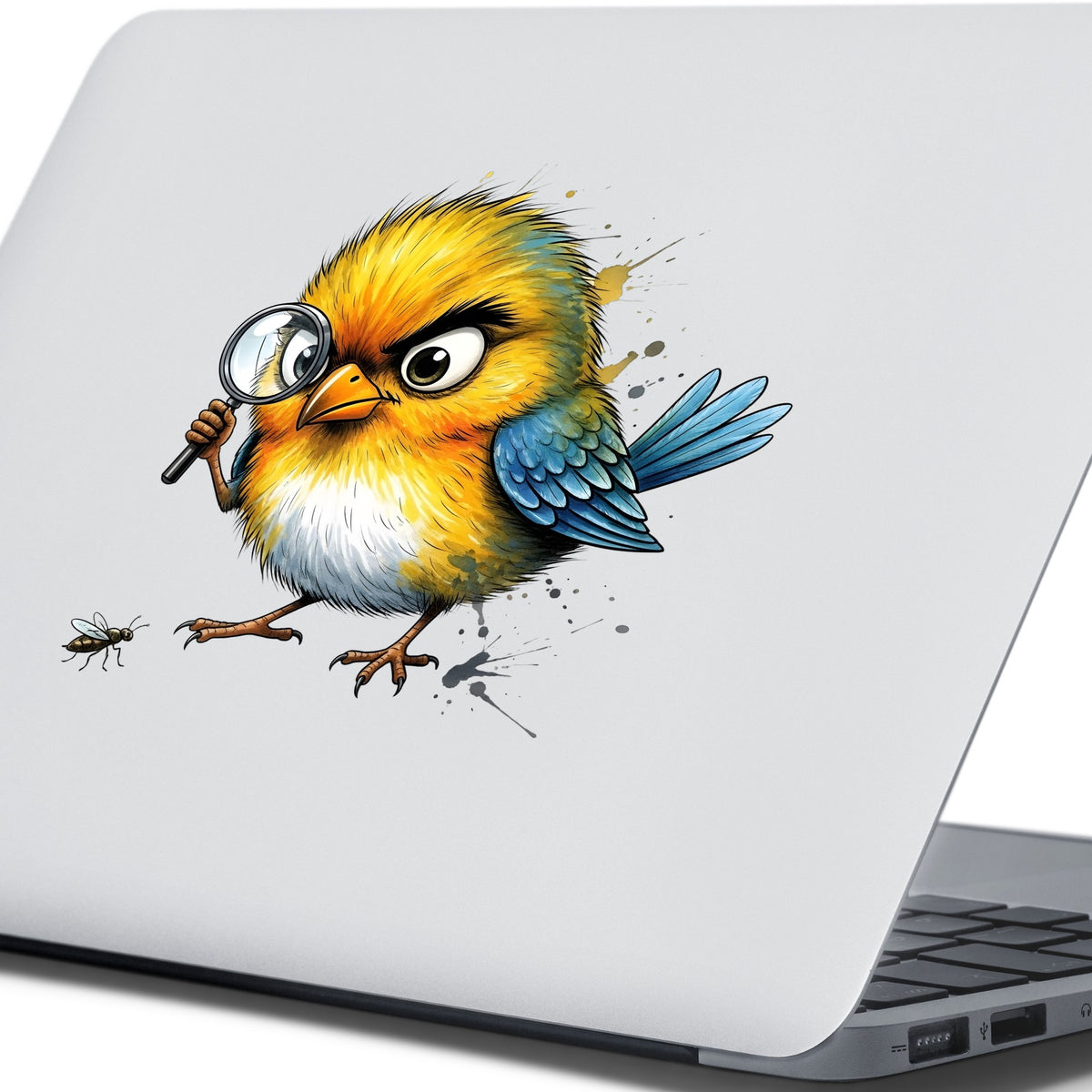 Yellow Bird Magnifying Glass Bug UV DTF sticker applied to the lid of a silver laptop