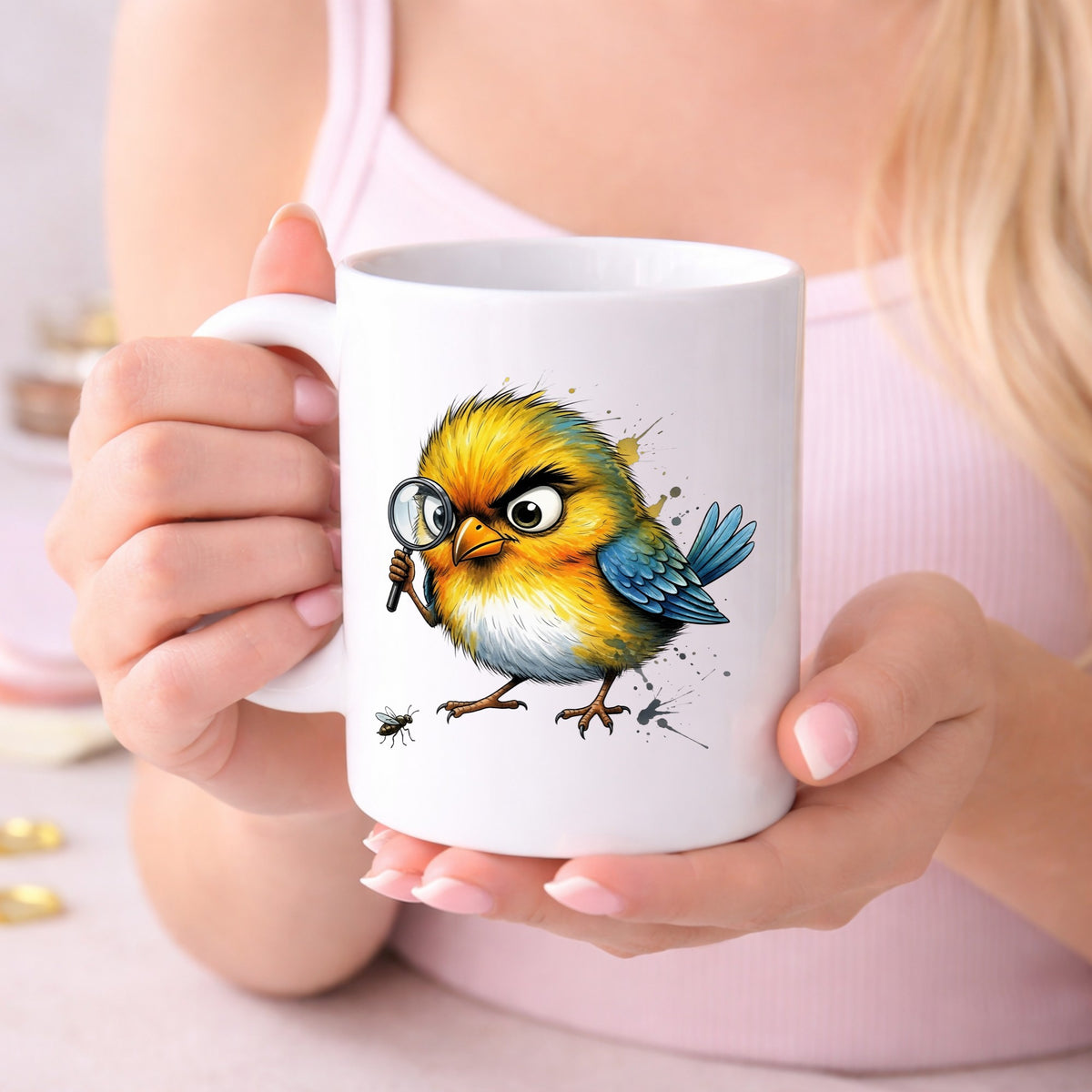 Yellow Bird Magnifying Glass Bug UV DTF sticker applied to a white coffee mug held in both hands
