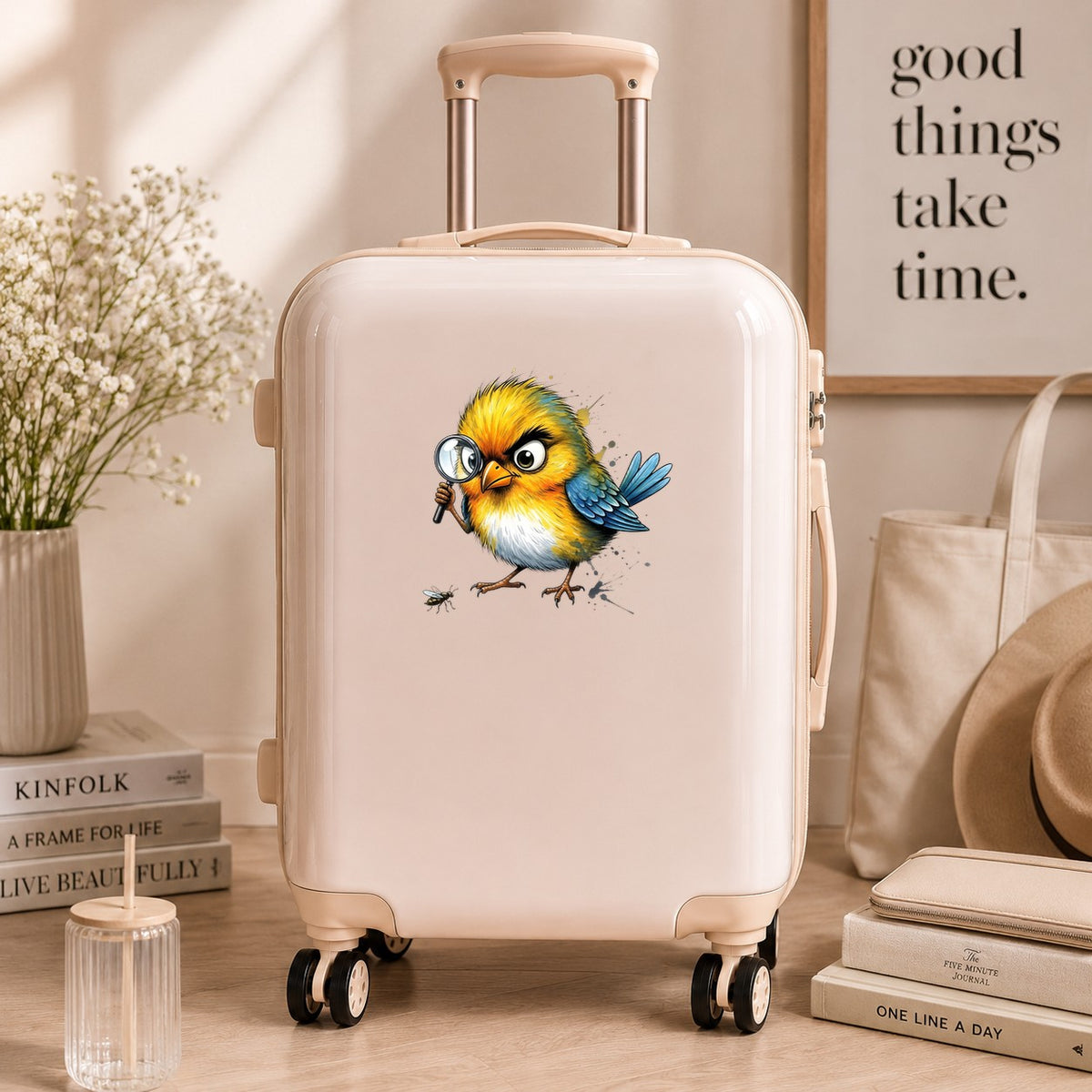 Yellow Bird Magnifying Glass Bug UV DTF sticker applied to a cream carry-on suitcase