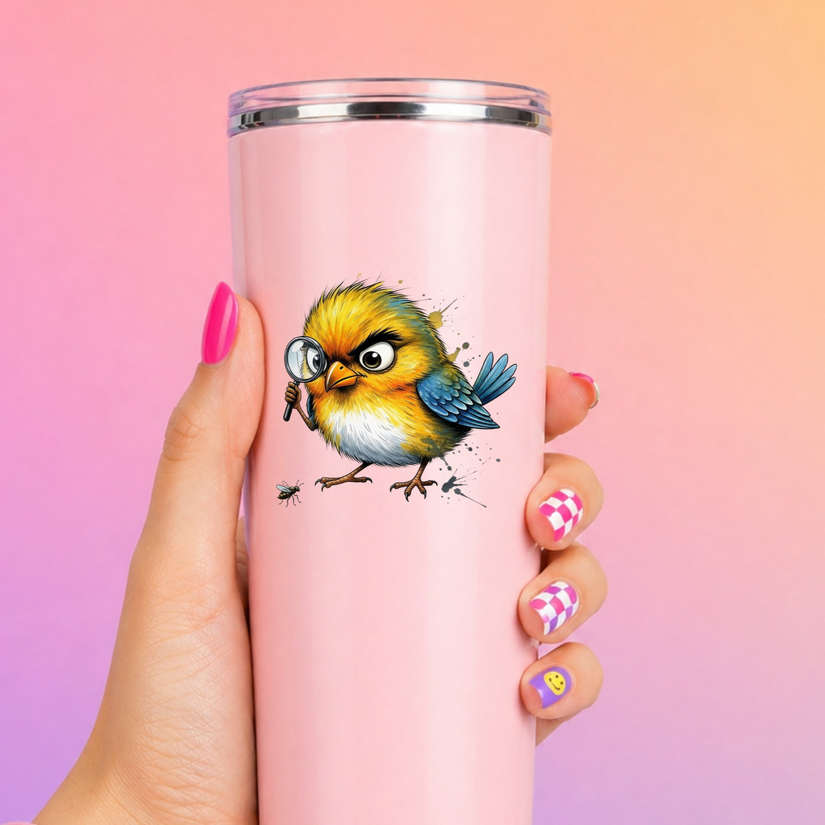 Yellow Bird Magnifying Glass Bug UV DTF sticker applied to a tall pink tumbler on a pink and orange background