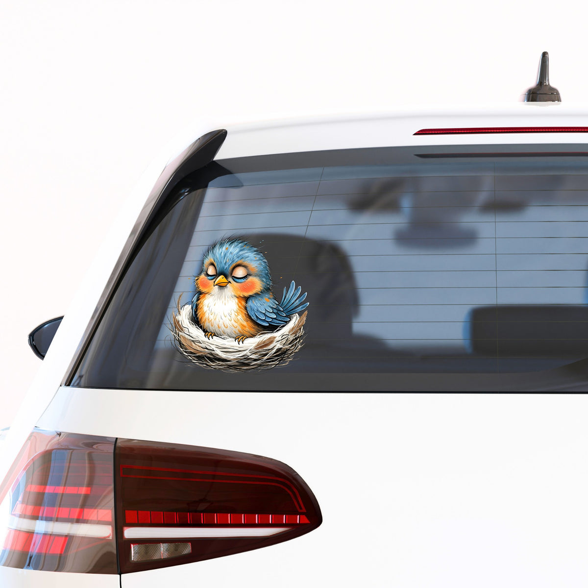 Sleeping Bird In Nest UV DTF sticker applied to the rear window of a white car