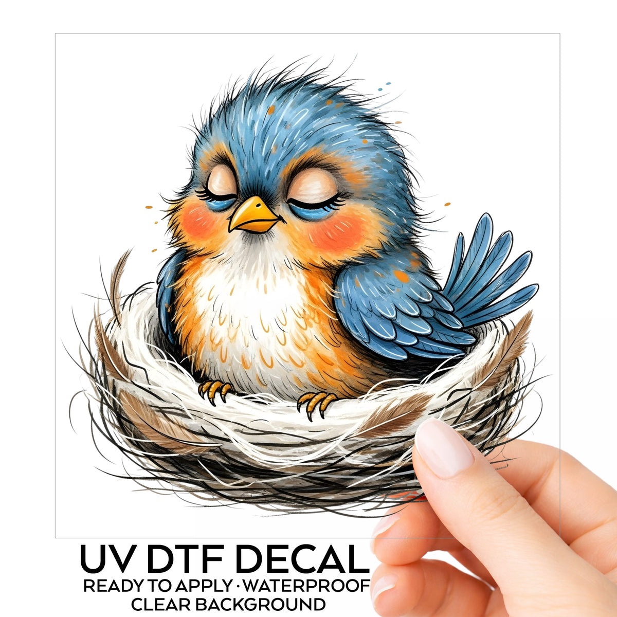 Sleeping Bird In Nest UV DTF sticker on its backing card, held in hand
