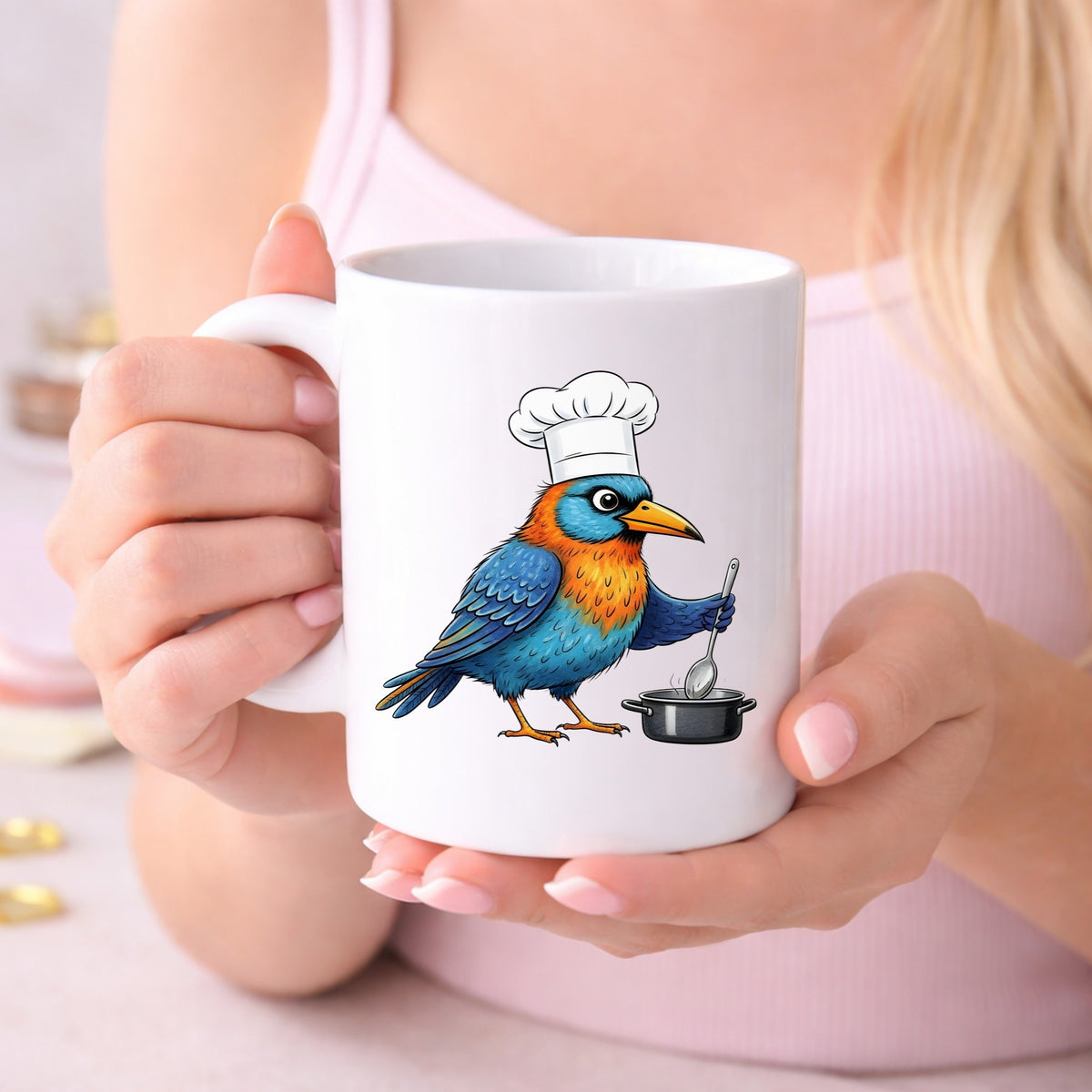 Chef Bird Cooking Pot UV DTF sticker applied to a white coffee mug held in both hands