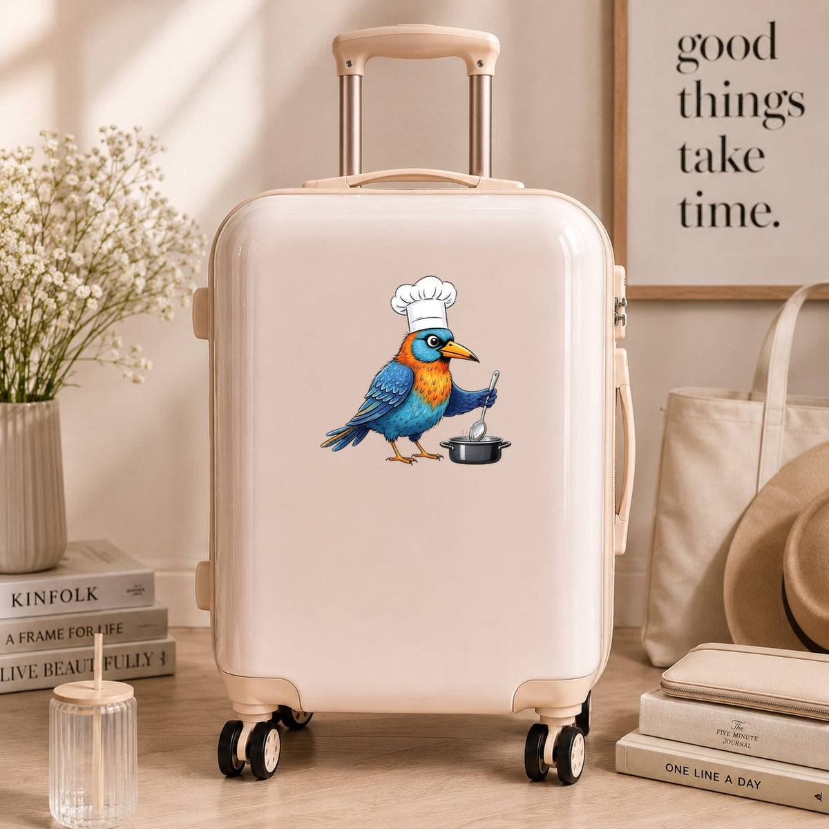 Chef Bird Cooking Pot UV DTF sticker applied to a cream carry-on suitcase