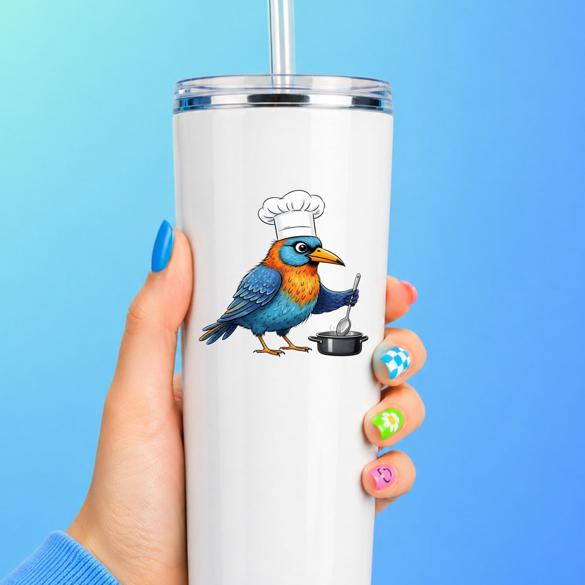 Chef Bird Cooking Pot UV DTF sticker applied to a white straw tumbler on a blue background