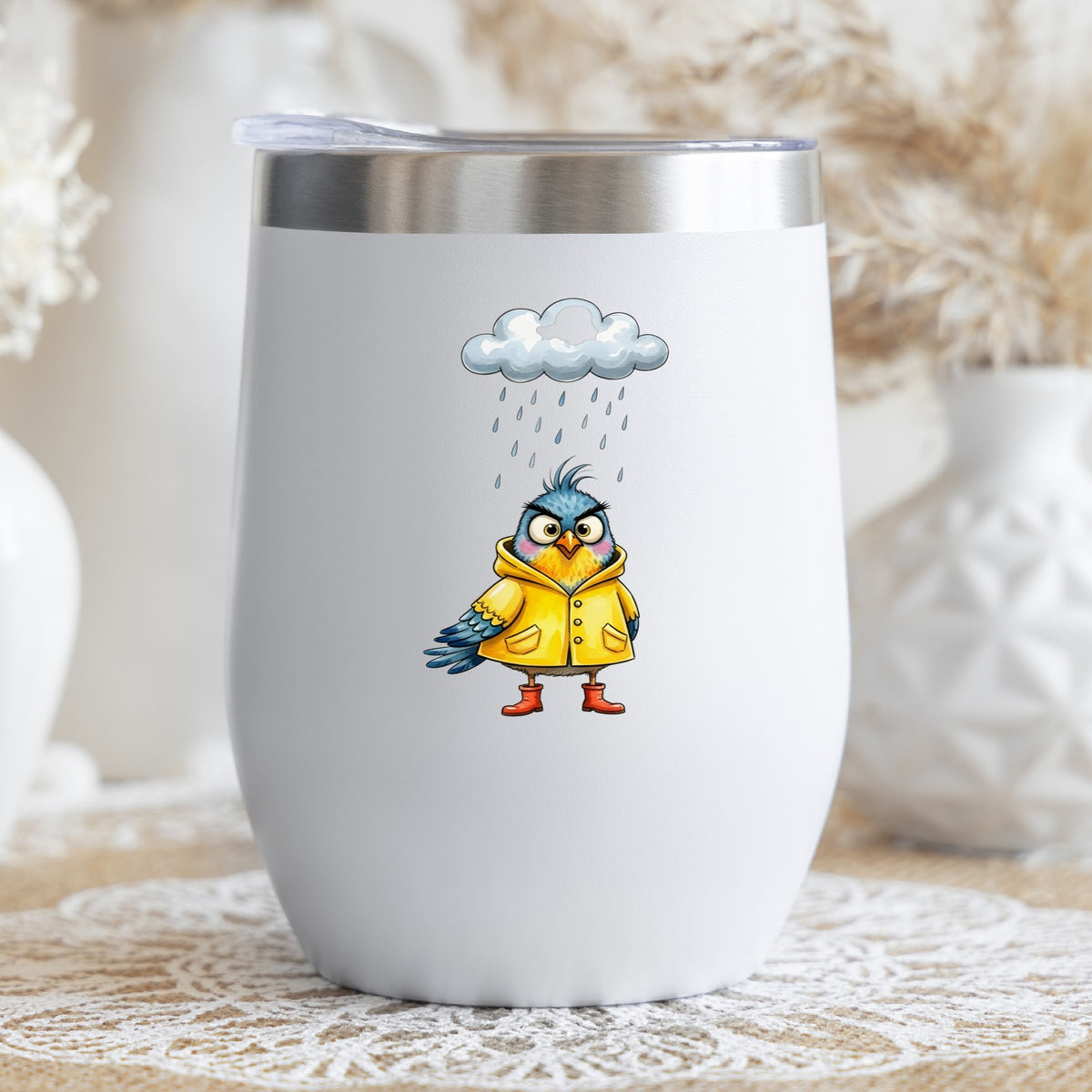 Rain Cloud Bird Yellow Raincoat UV DTF sticker applied to a white stemless tumbler with a lid