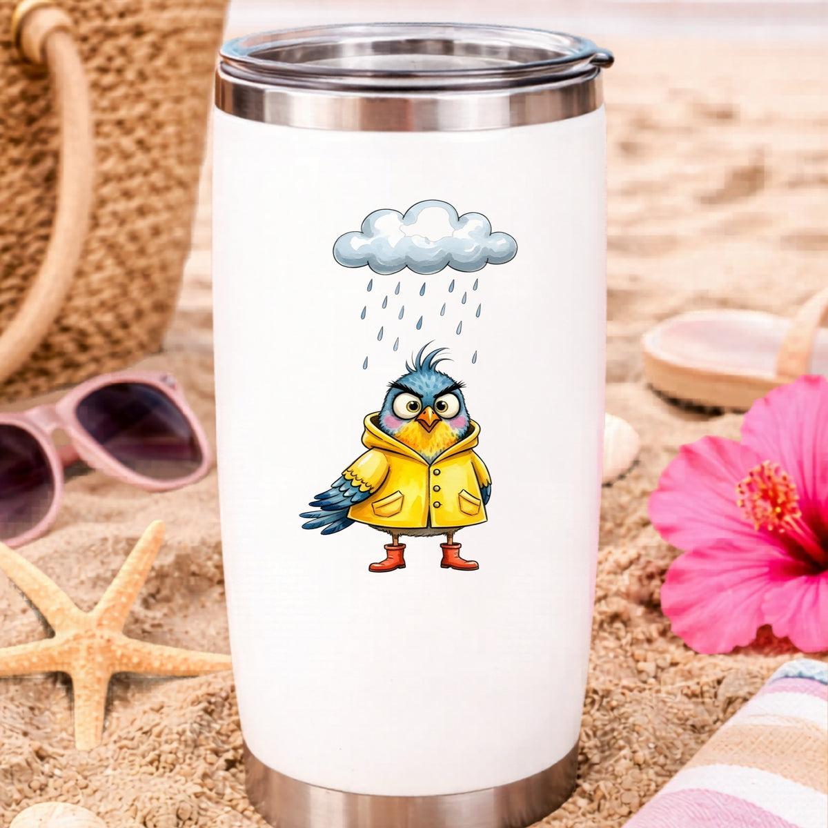 Rain Cloud Bird Yellow Raincoat UV DTF sticker applied to a white travel tumbler on beach sand