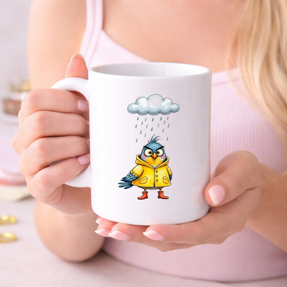 Rain Cloud Bird Yellow Raincoat UV DTF sticker applied to a white coffee mug held in both hands