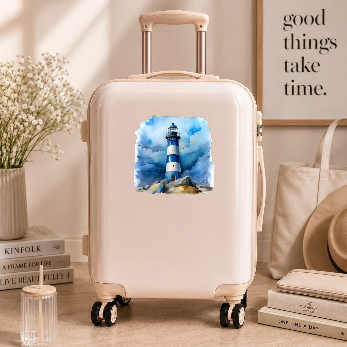 Blue Striped Lighthouse On Rocks UV DTF sticker applied to a cream carry-on suitcase