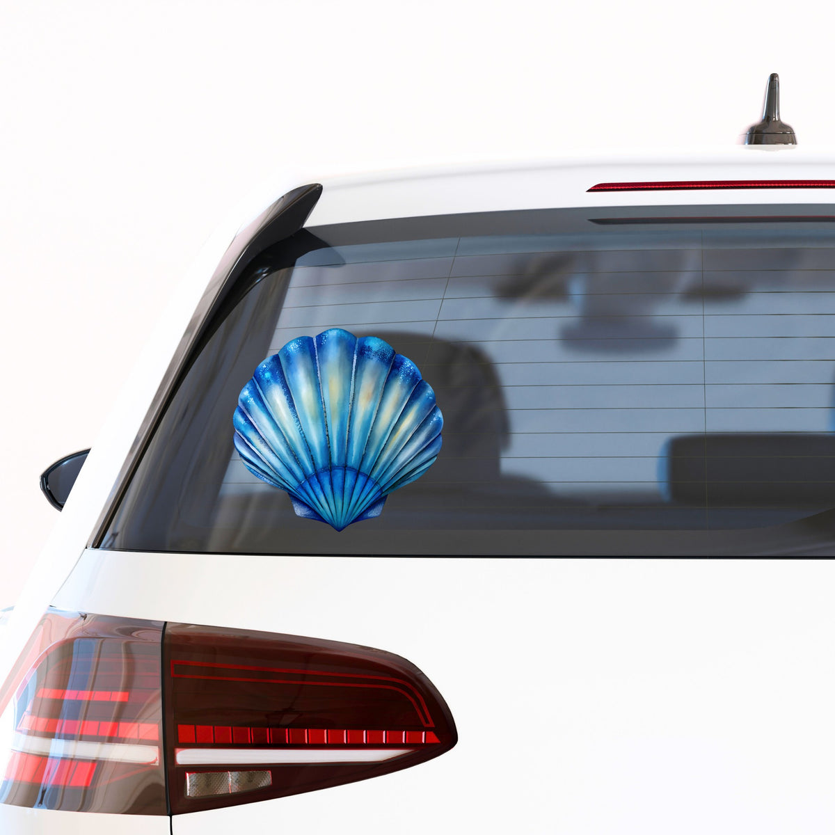 Blue Scallop Seashell UV DTF sticker applied to the rear window of a white car