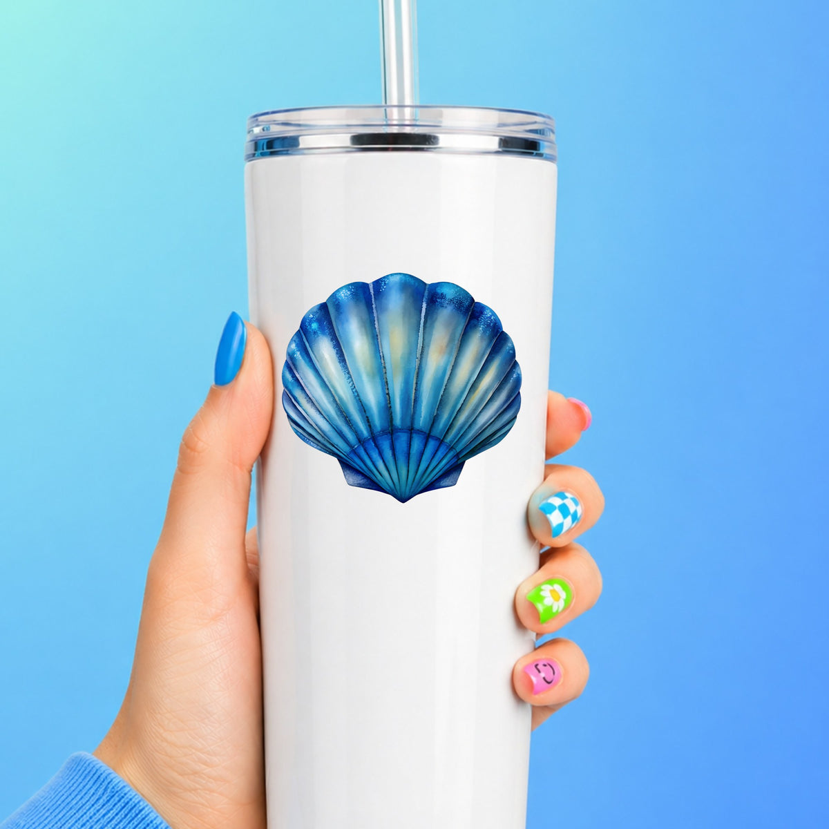 Blue Scallop Seashell UV DTF sticker applied to a white straw tumbler on a blue background