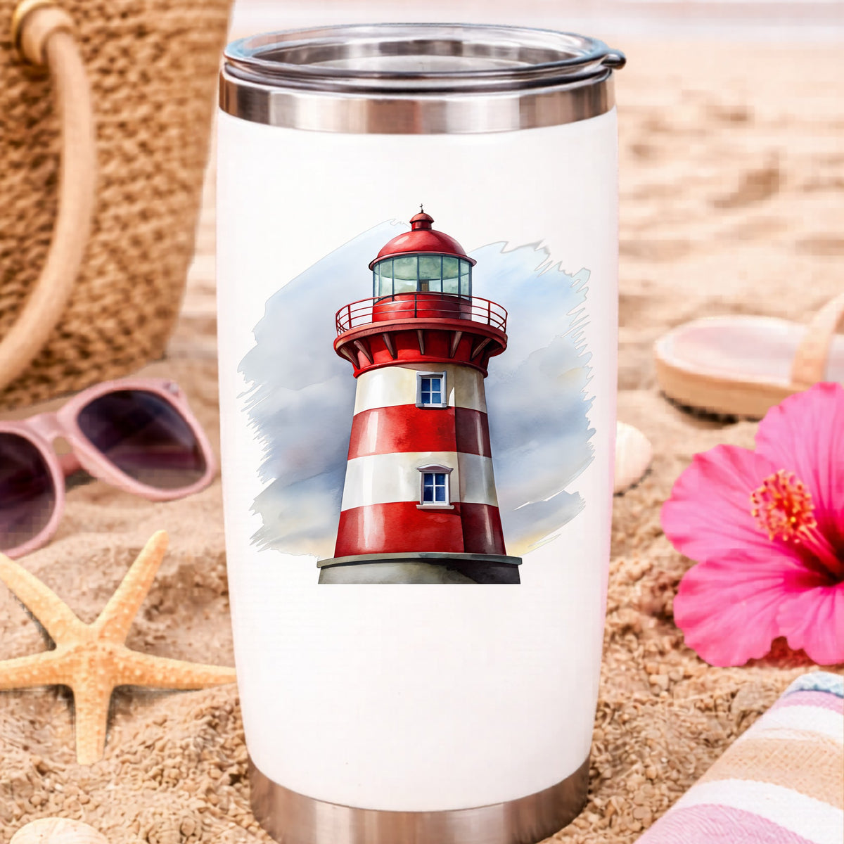 Red And White Lighthouse UV DTF sticker applied to a white travel tumbler on beach sand